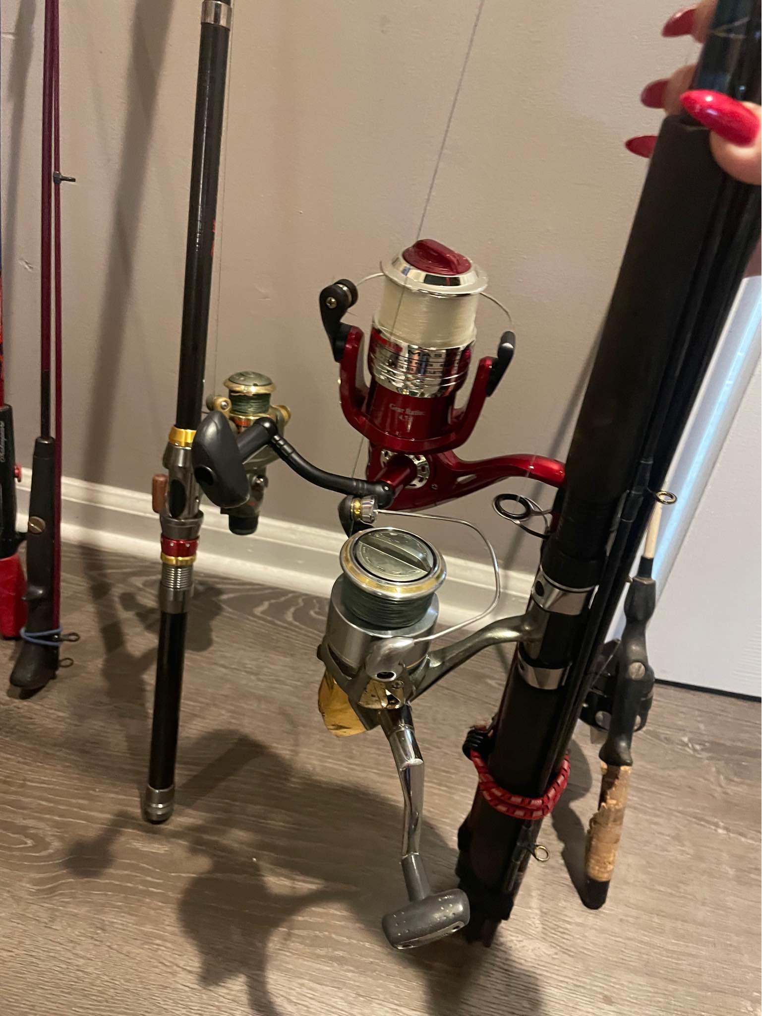 4 fishing rods with reels and two boxes of fake bait , fishing goodies ...