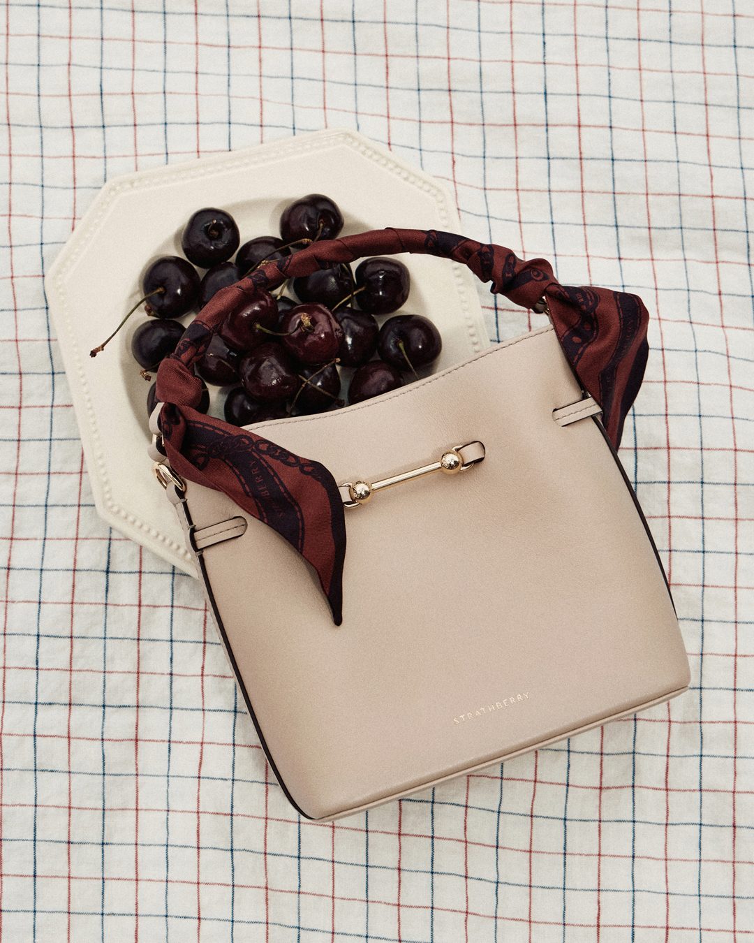 Strathberry - Vanilla dream Shop the East/West Mini in Vanilla at
