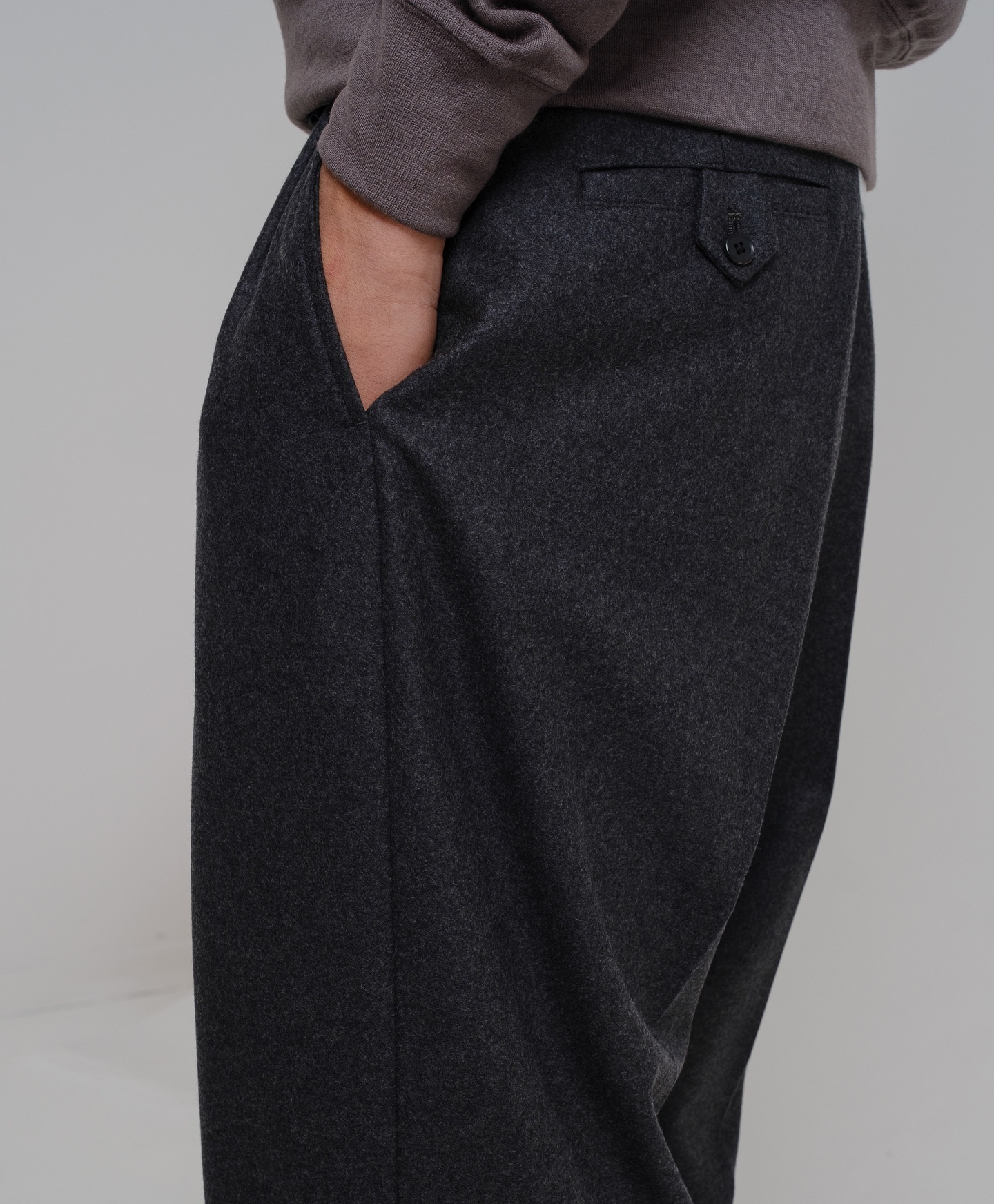 Erik is wearing the A.PRESSE Wide Tapered Trousers crafted from a 
