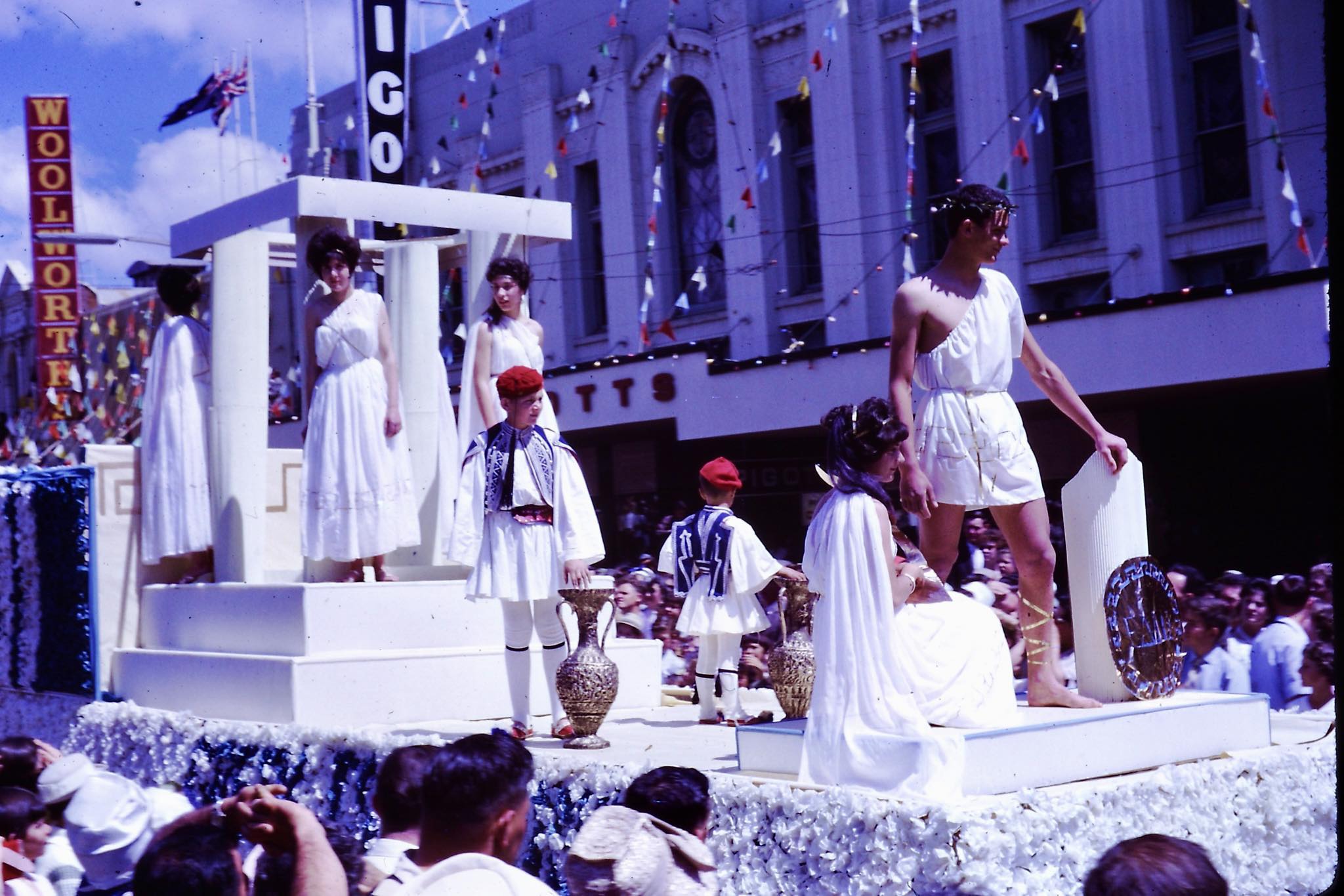 Remember - A Greek-themed float parades by Pigott’s in the Carnival of ...