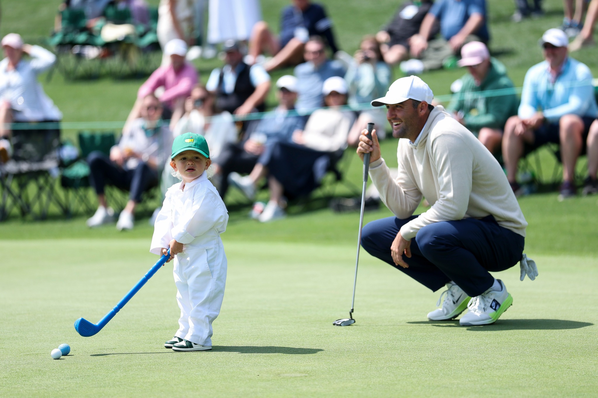 golf dress nori green Scottie Scheffler of the United States smiles alongside son Bennett during the Par Three Contest prior to the 2026 Masters Tournament at Augusta National Club in Augusta, Georgia Tennis