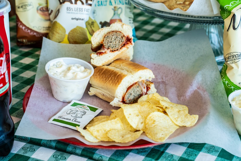Pickerman's - Enjoy a hearty meatball sub with crispy chips and a side ...