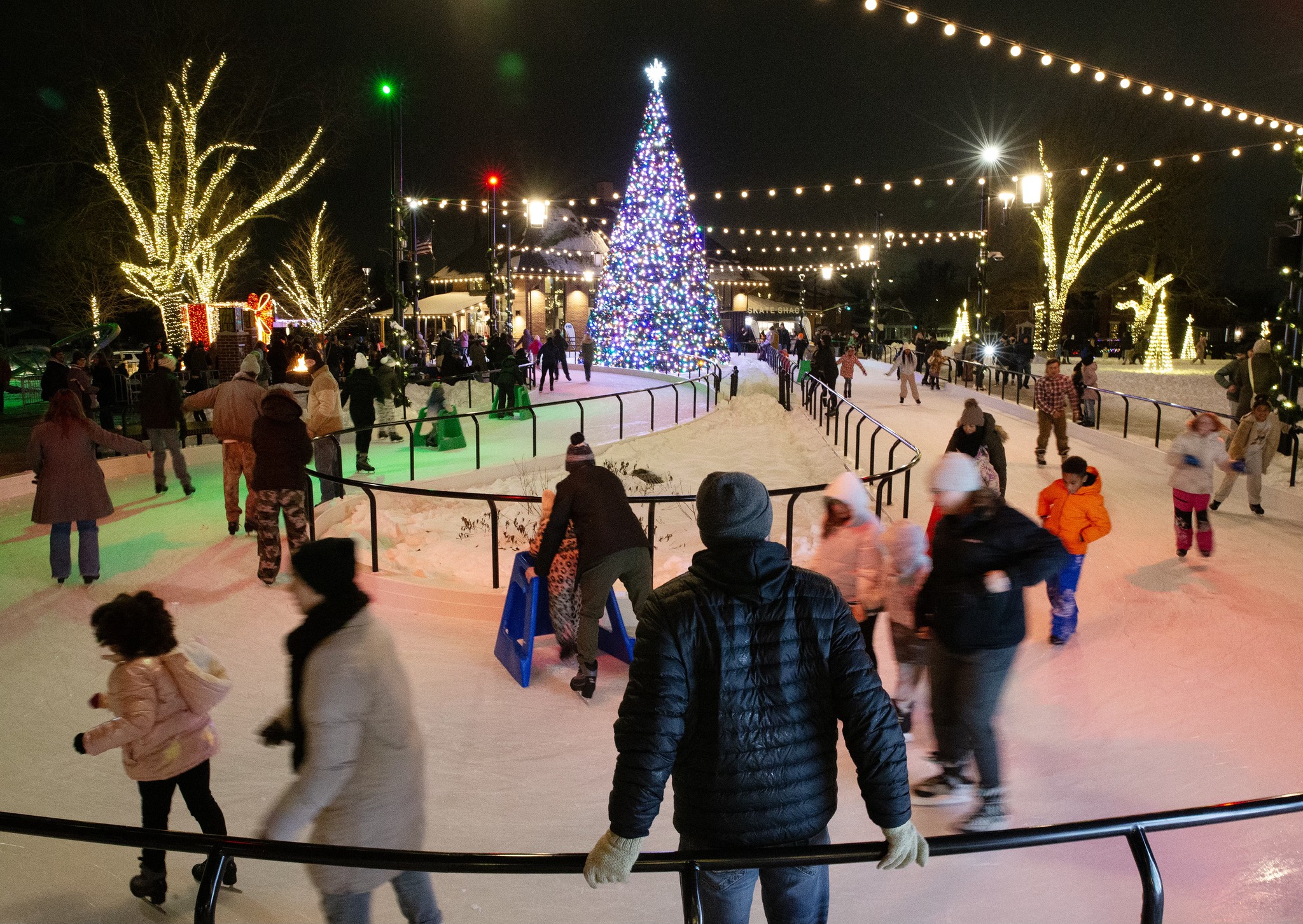 The Gazette - Community members skate around the ice loop during uptown ...