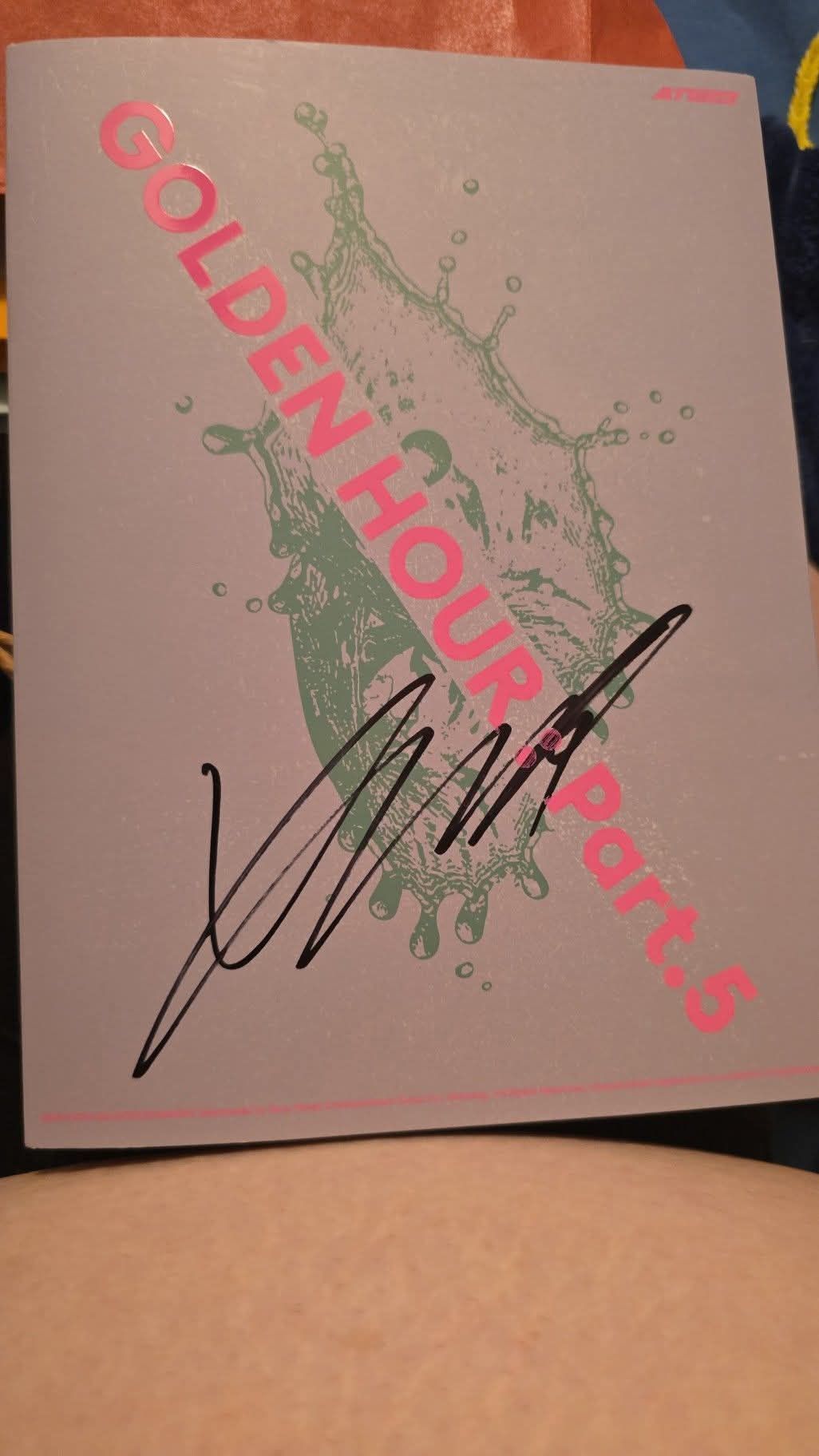 Ateez members' signatures on poster