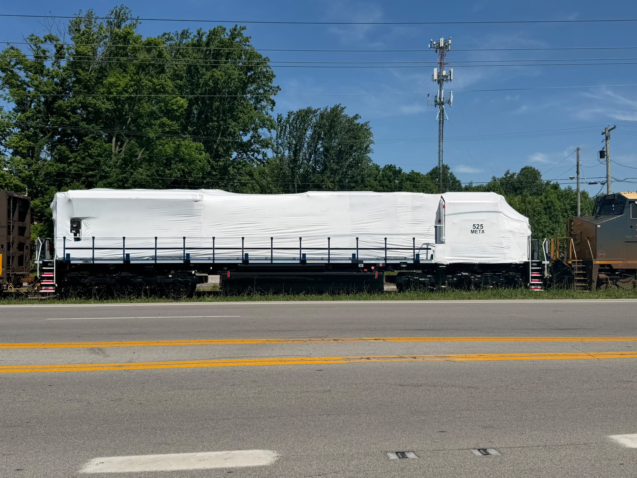 J.B. - Metra's latest SD70MACH METX 525 shrink wrapped up on CSX