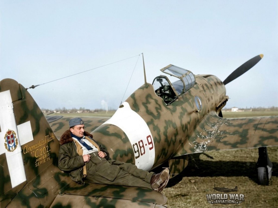 Sitting on the horizontal stabilizer of his M.C 202 is Fighter ACE