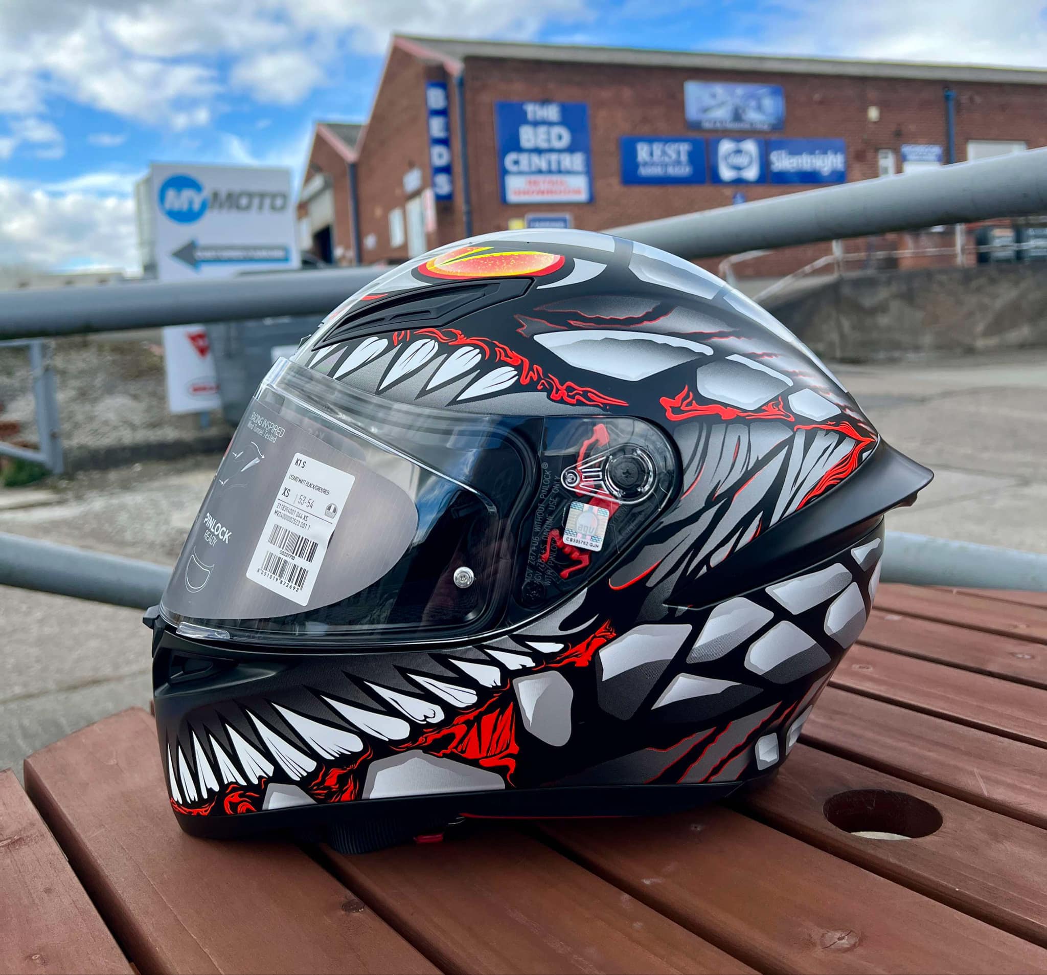 agv k1 shark S face motorcycle helmet has a thermoplastic resin outer with four densities of shock    - 