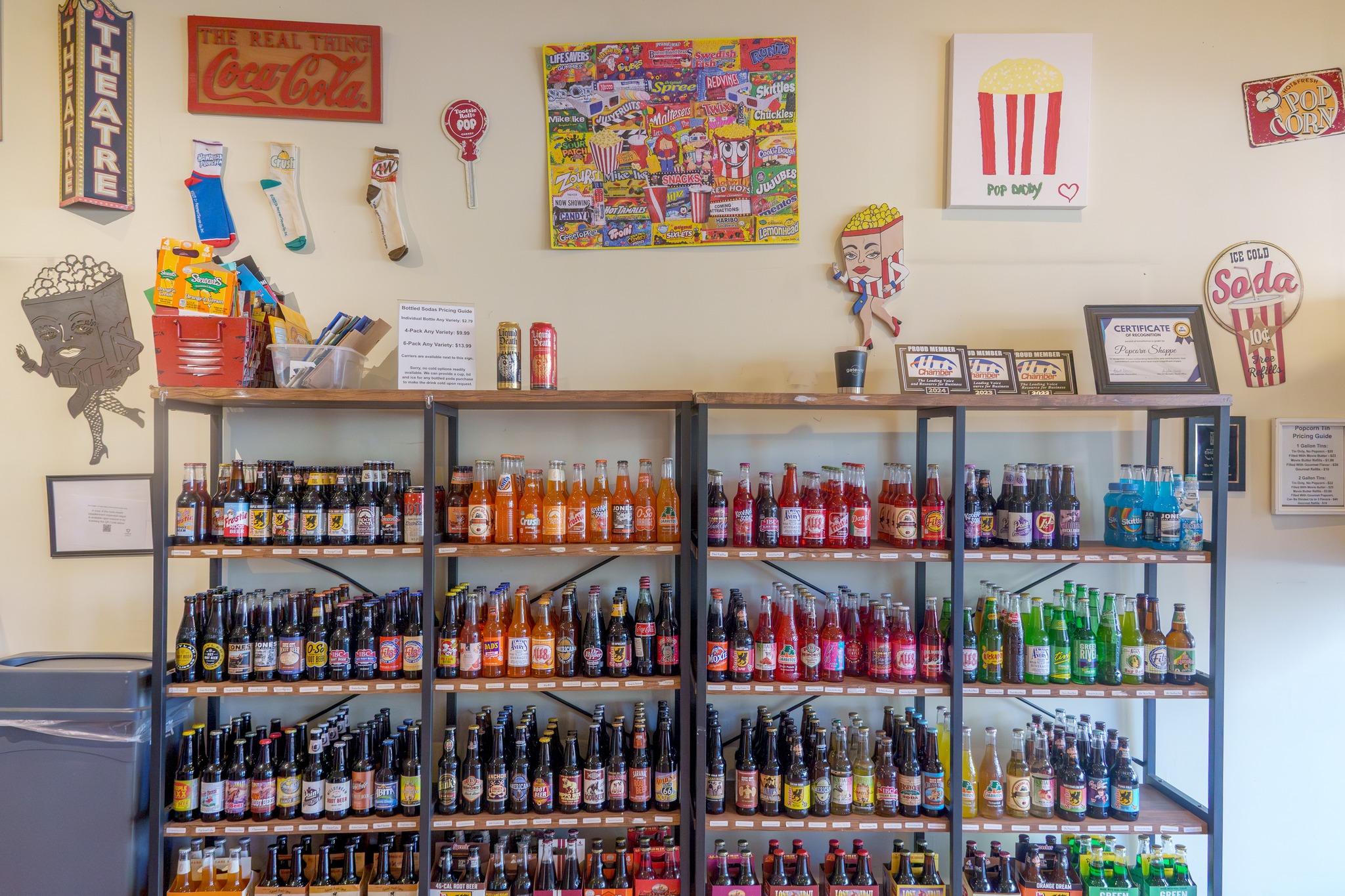 Journal - Dozens of brands of bottled soda fill a shelf at the new ...