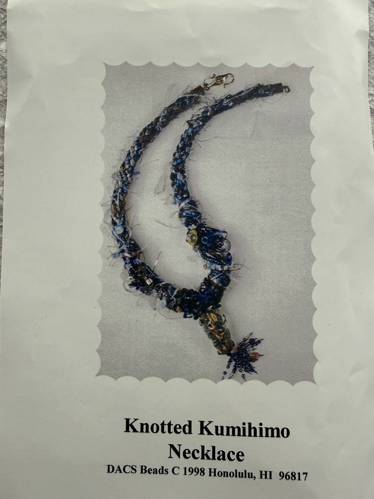 Knotted bead kumihimo with textured yarns and accent beads