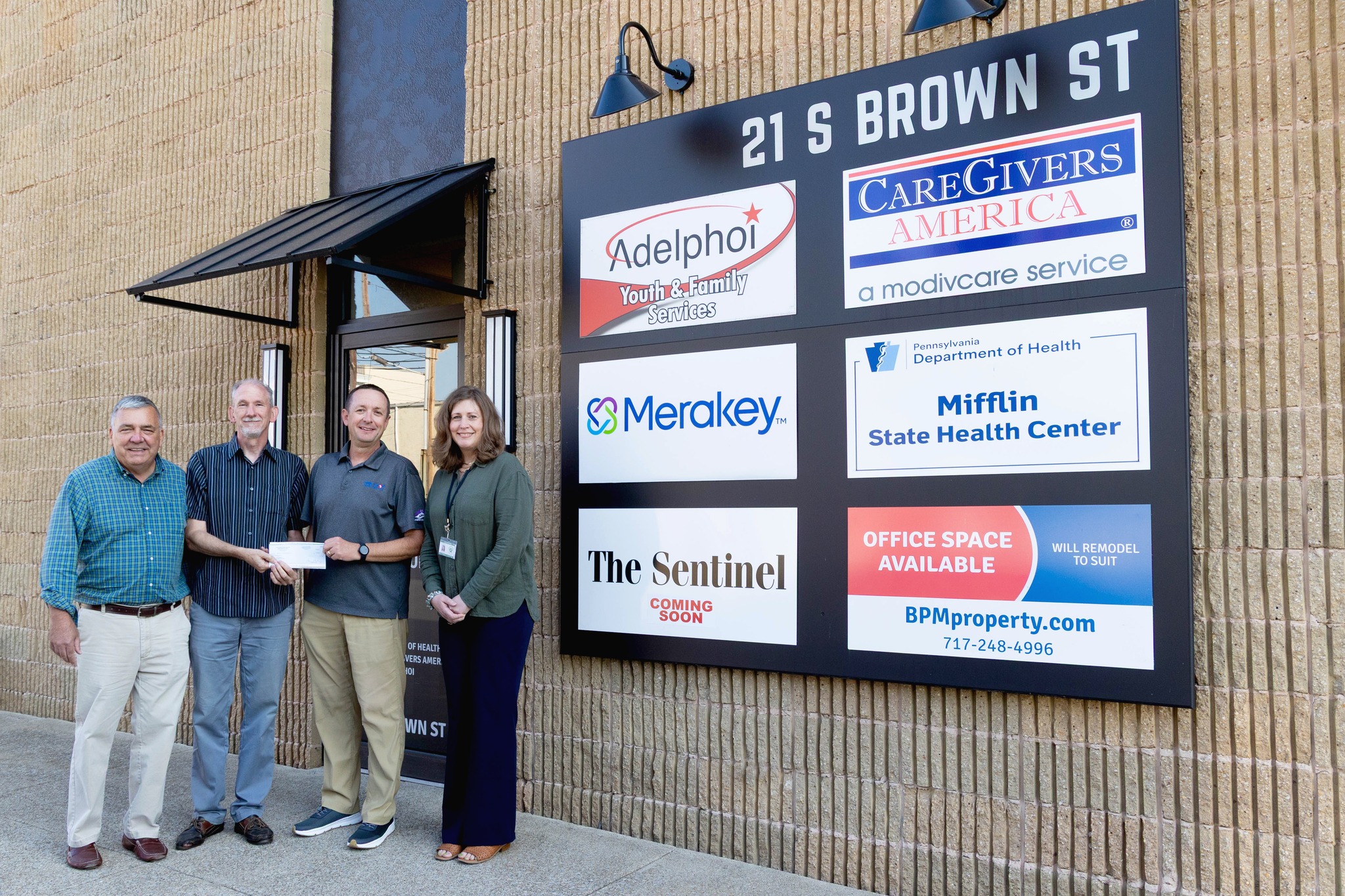 Downtown - Another reimbursement check presentation for a major facade ...