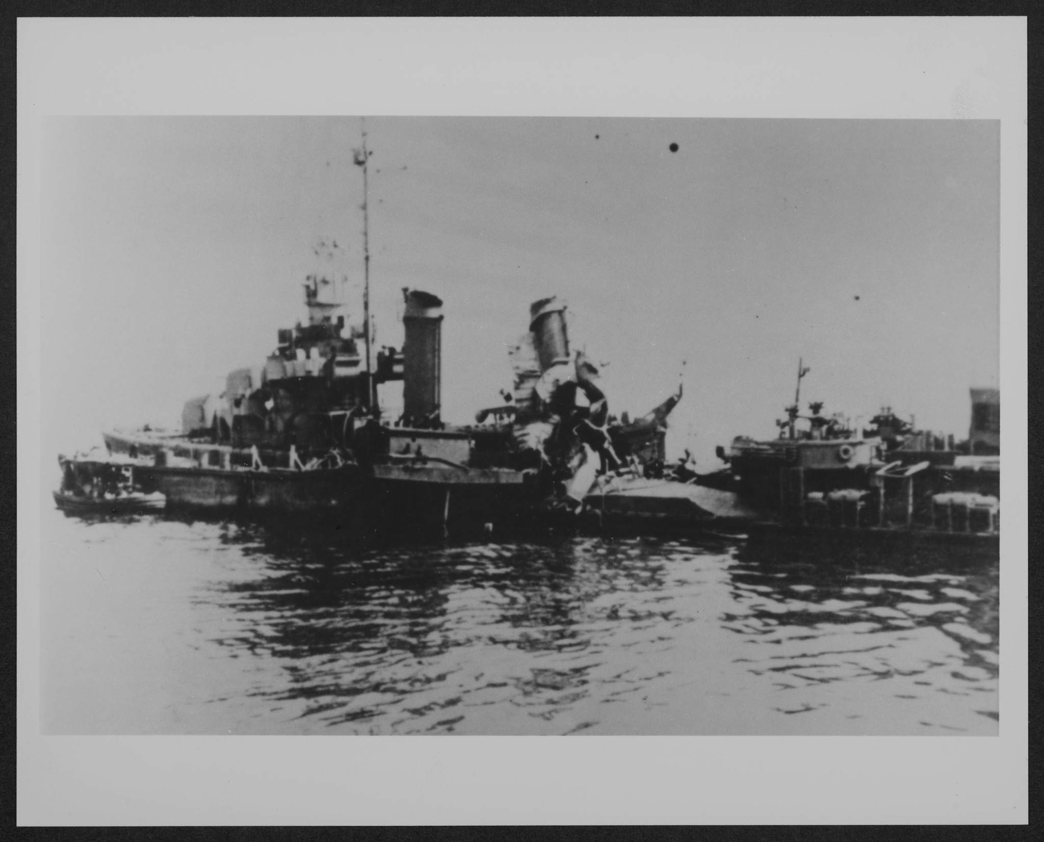 Navy crewmen on the light cruiser USS Nashville (CL-43) are seen