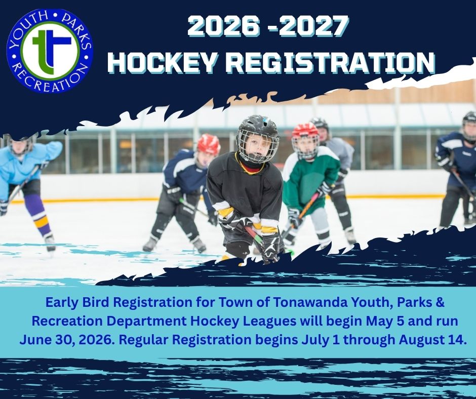 Youth ice hockey players in teal and red jerseys on rink