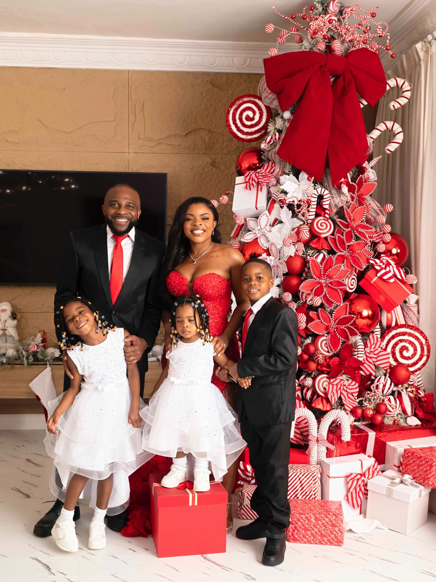 Merry Christmas from the Kanus to u. God bless u all. My dress from @ericamoorebrand