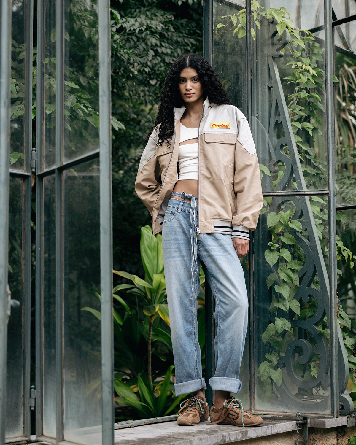 An iconic statement.​ Leather varsity jacket, sun-washed denim 
