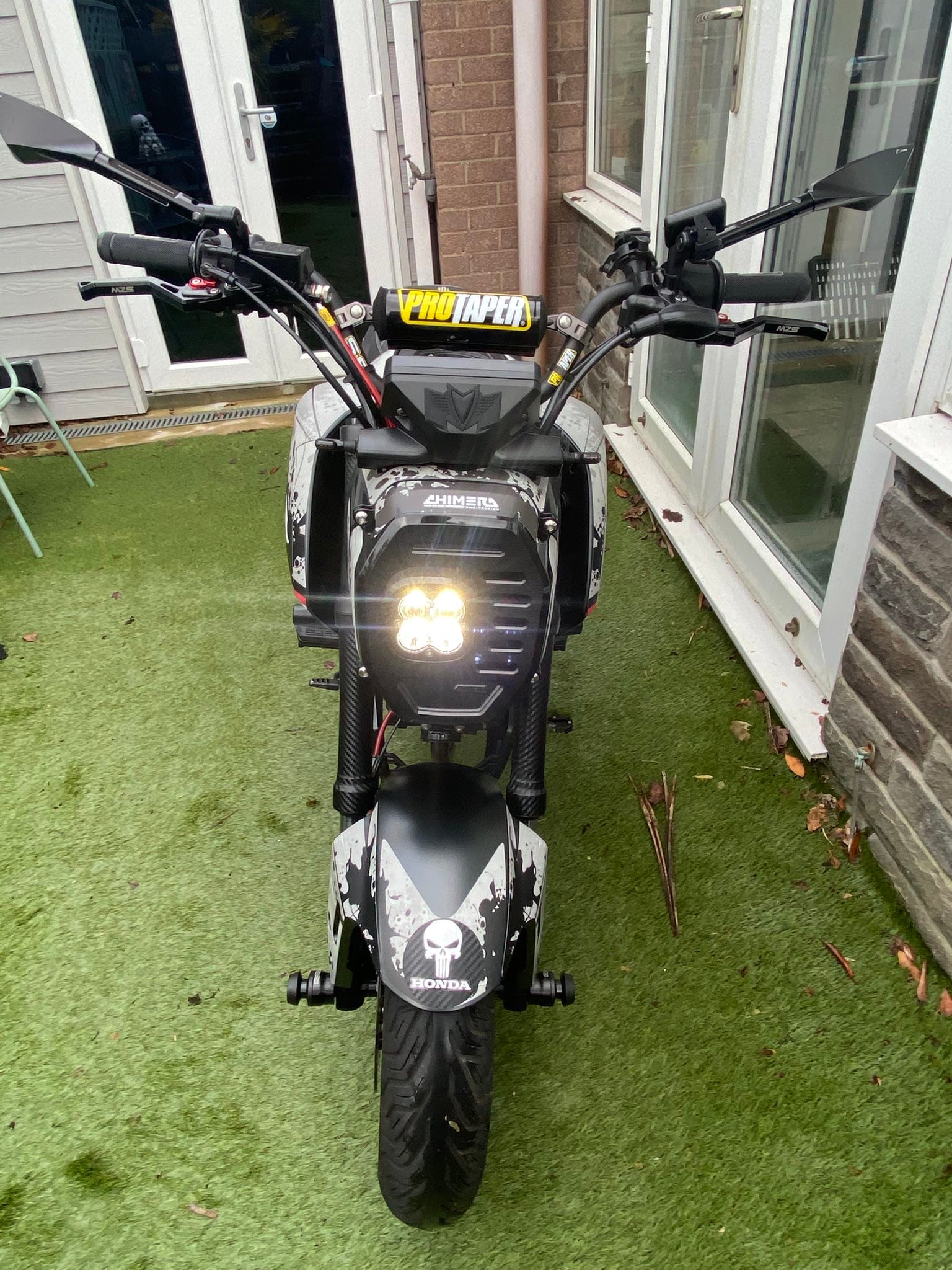 Custom-modified Honda Grom with Chimera stretch kit and Baja headlight