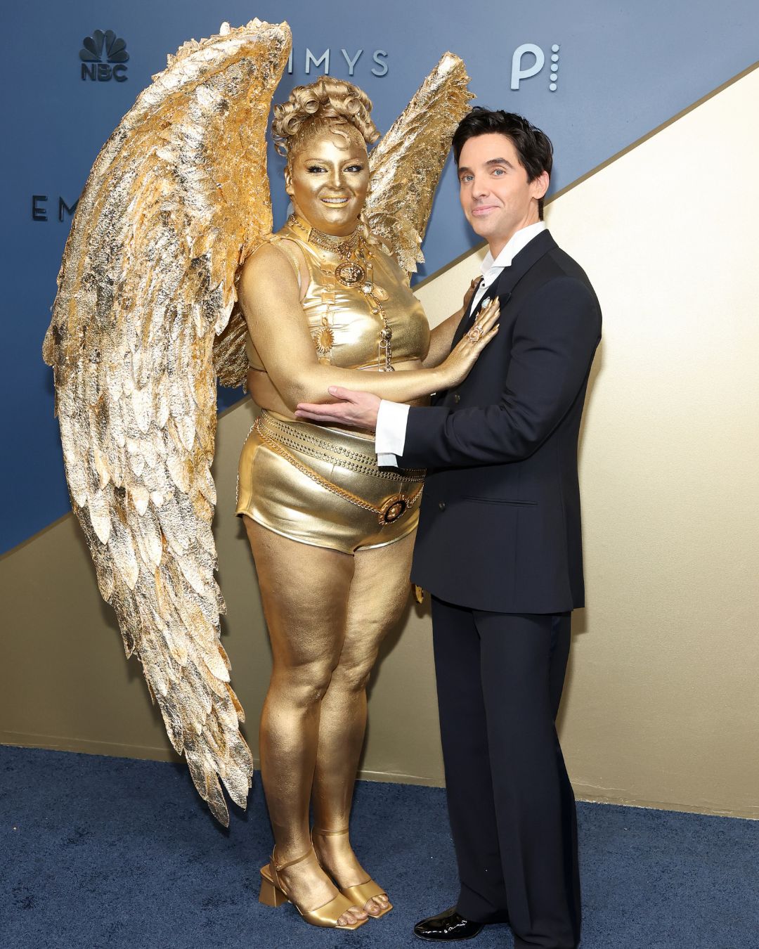 Me when they say there's no dress code. 😂🏆 #MeganStalter took the #Emmys red carpet to a whole level by covering herself in gold. ✨ See more: bit.ly/4A7YqkR 📸: Amy Sussman/Getty Images