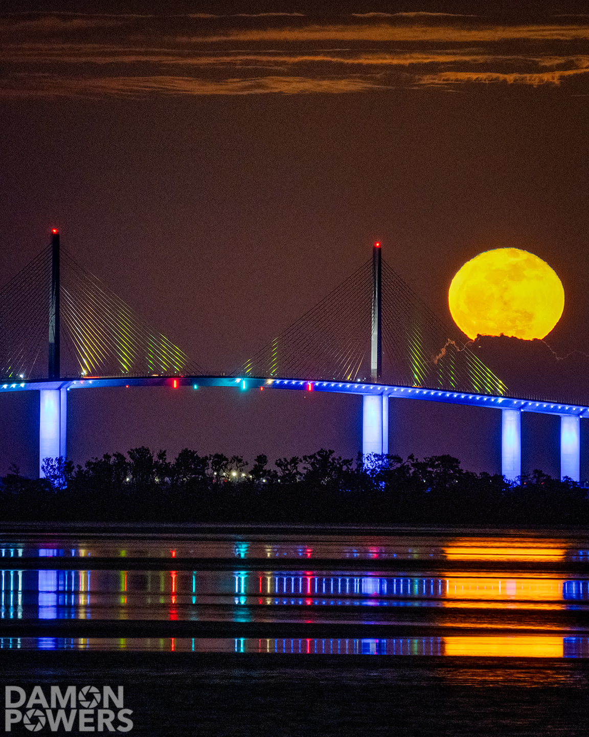 Full moon rising behind the Sunshine Skyway Bridge 🌕 #flwx