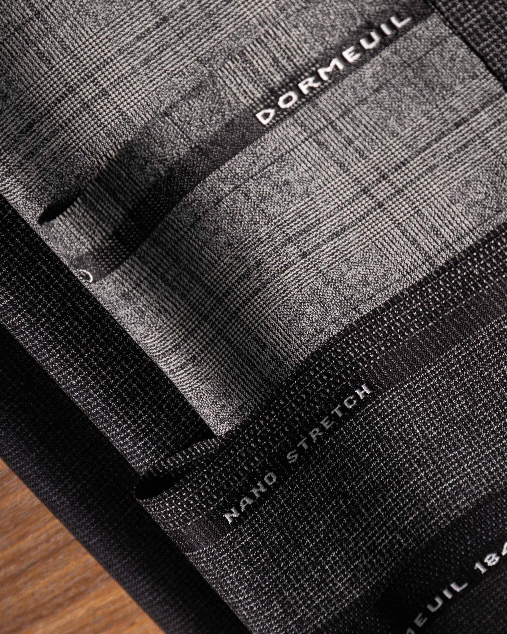 The suit that keeps up with you. Dormeuil Nano Stretch | wrinkle