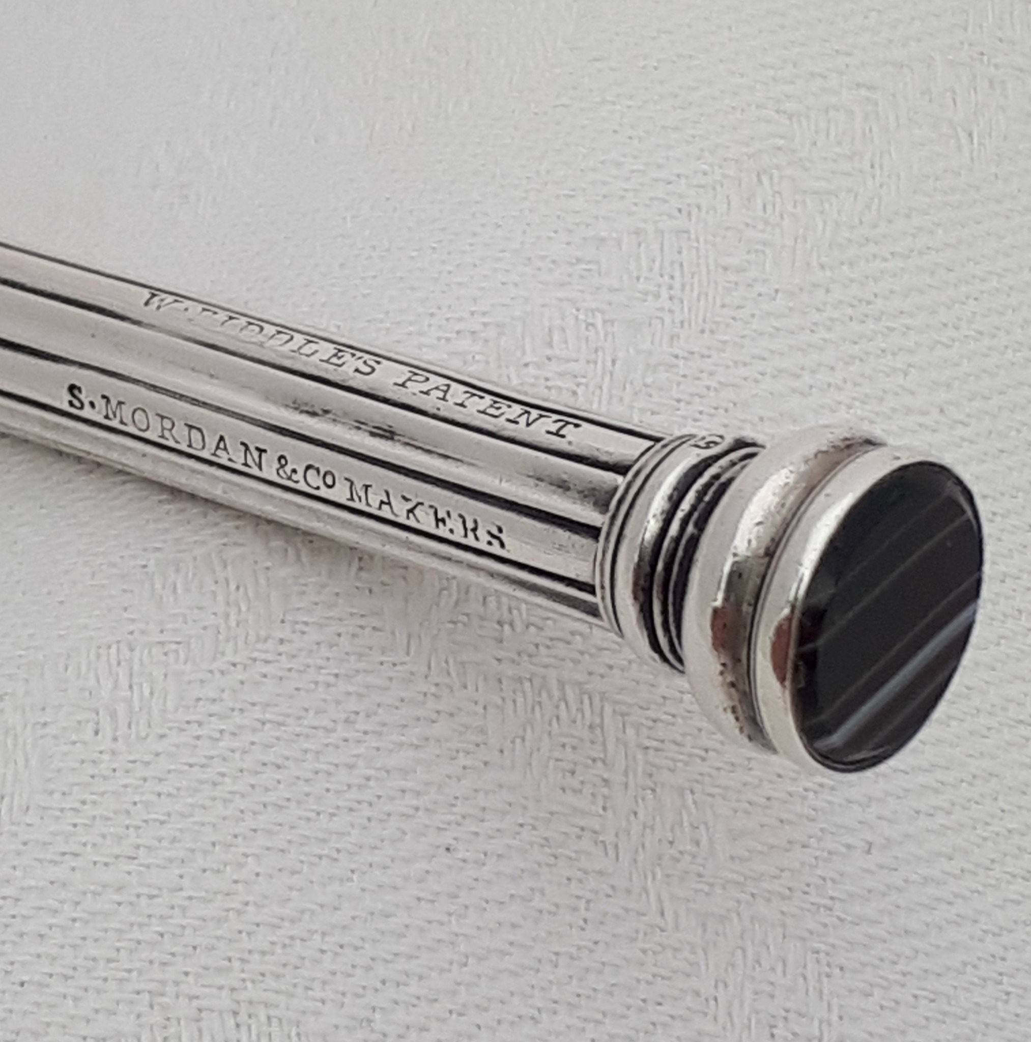 What are the characteristics of this 1850s silver propelling pencil?