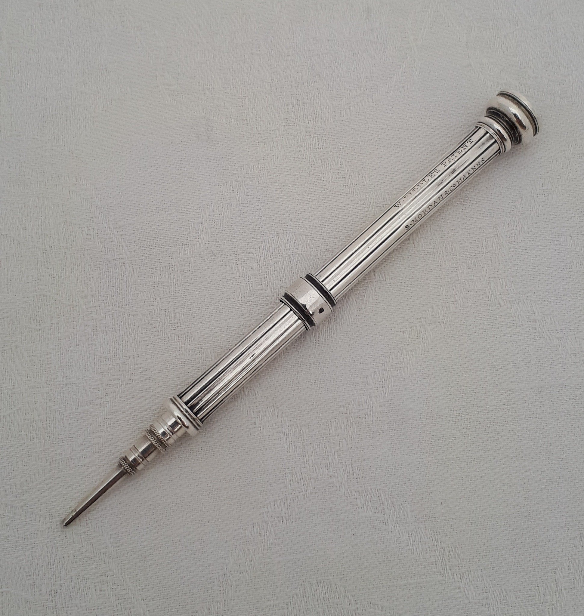 What are the characteristics of this 1850s silver propelling pencil?