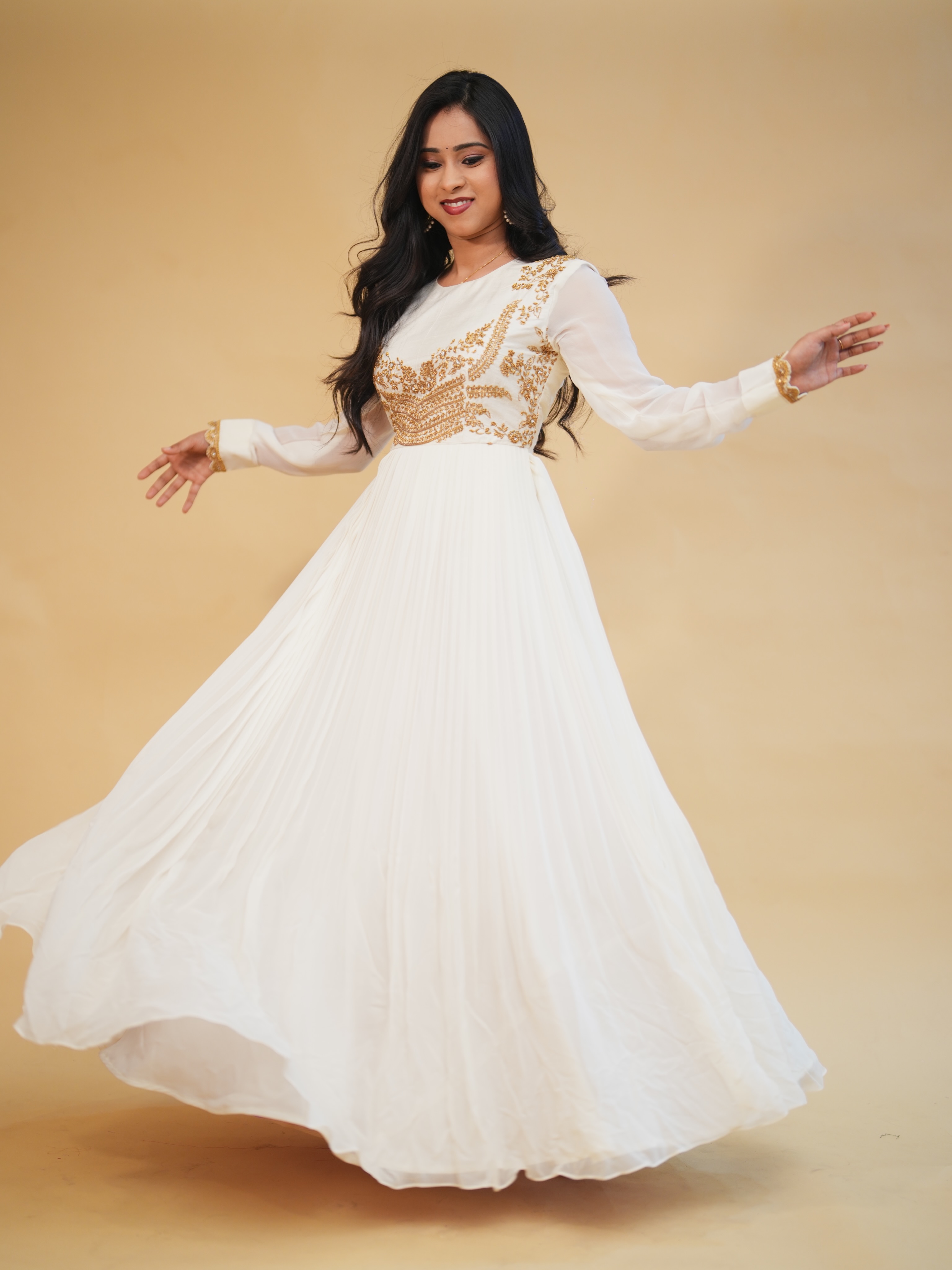 white and gold anarkali dress pleated gown, beautifully enhanced with intricate embroidery. Crafted for women who love classic charm with a modern touch, this outfit is perfect for festive celebrations, engag launch_date:8/1/2023