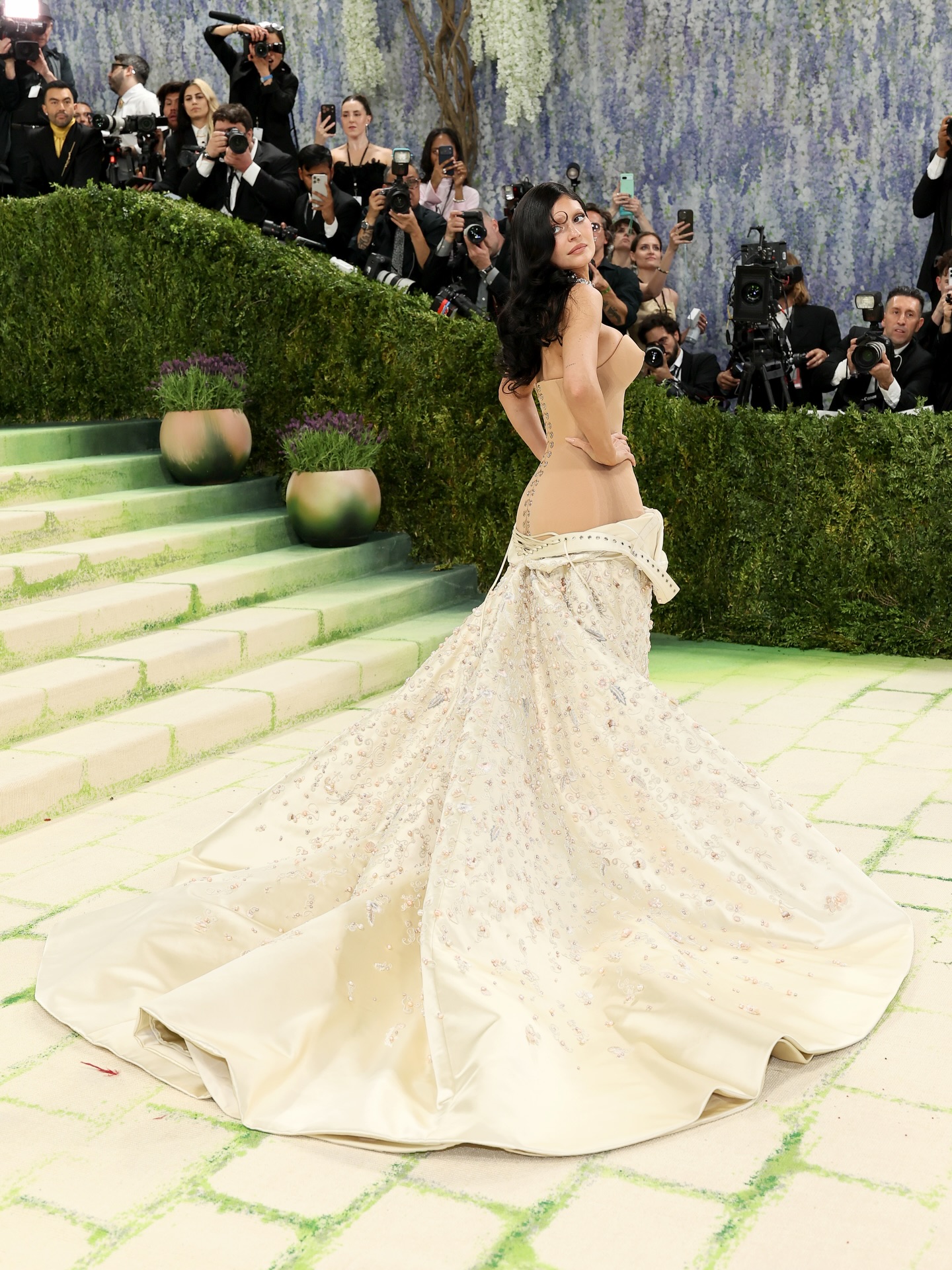 Kylie Jenner shocks in custom Schiaparelli on the red carpet at the Met Gala. See more photos on Just Jared! #KylieJenner #MetGala #MetGala2026 Photos: Getty