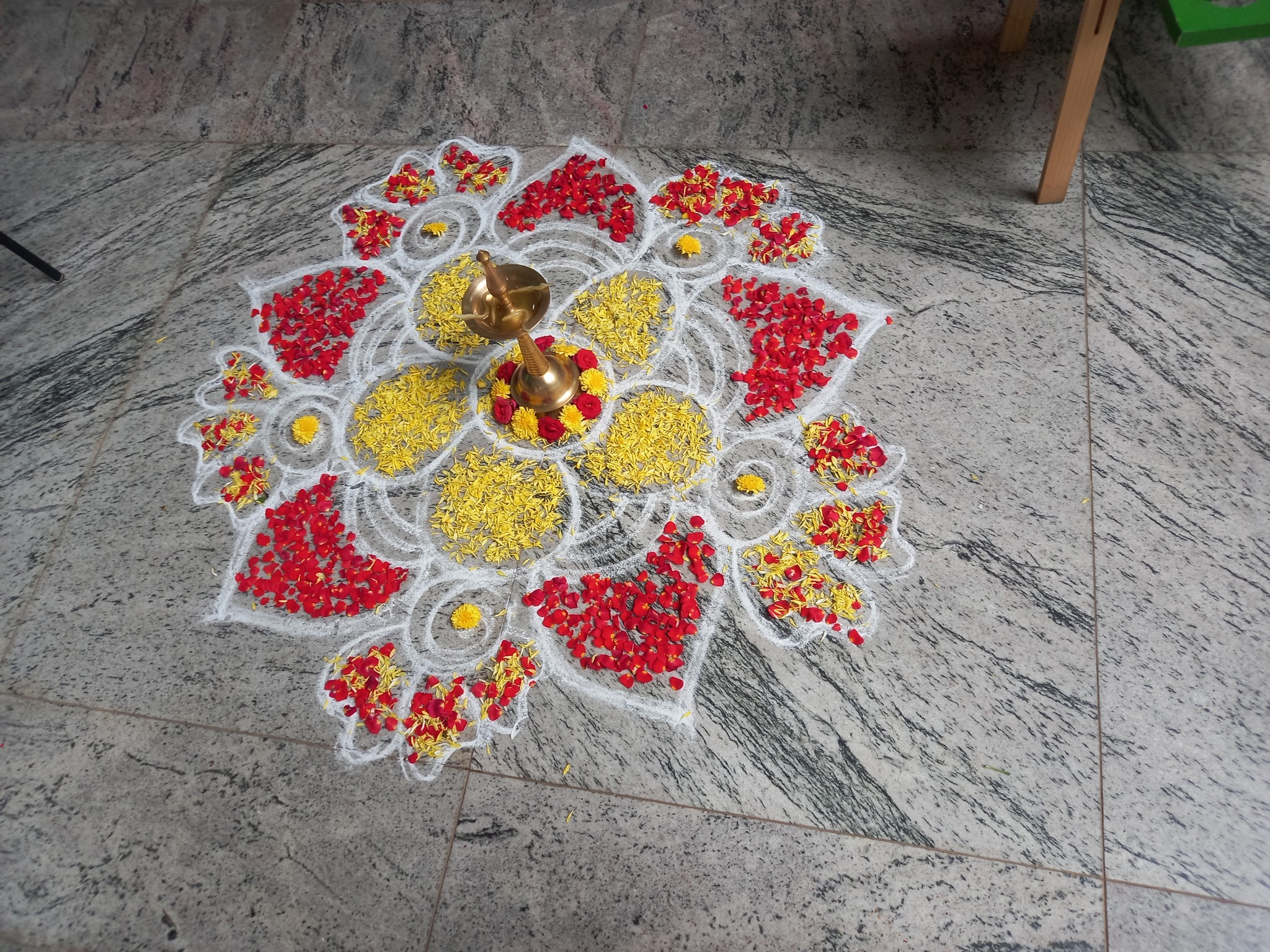 Onam Celebrations......colorful flower Rangoli with colorful art made ...