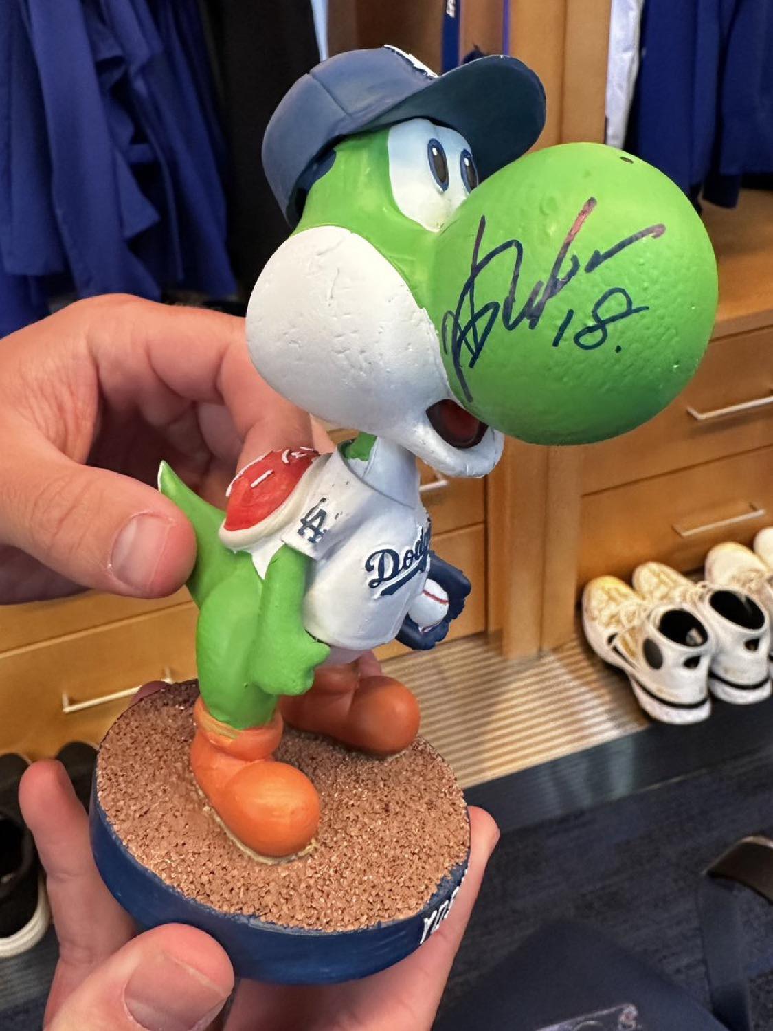 Yoshinobu Yamamoto signs Dodgers players' Yoshi bobbleheads
