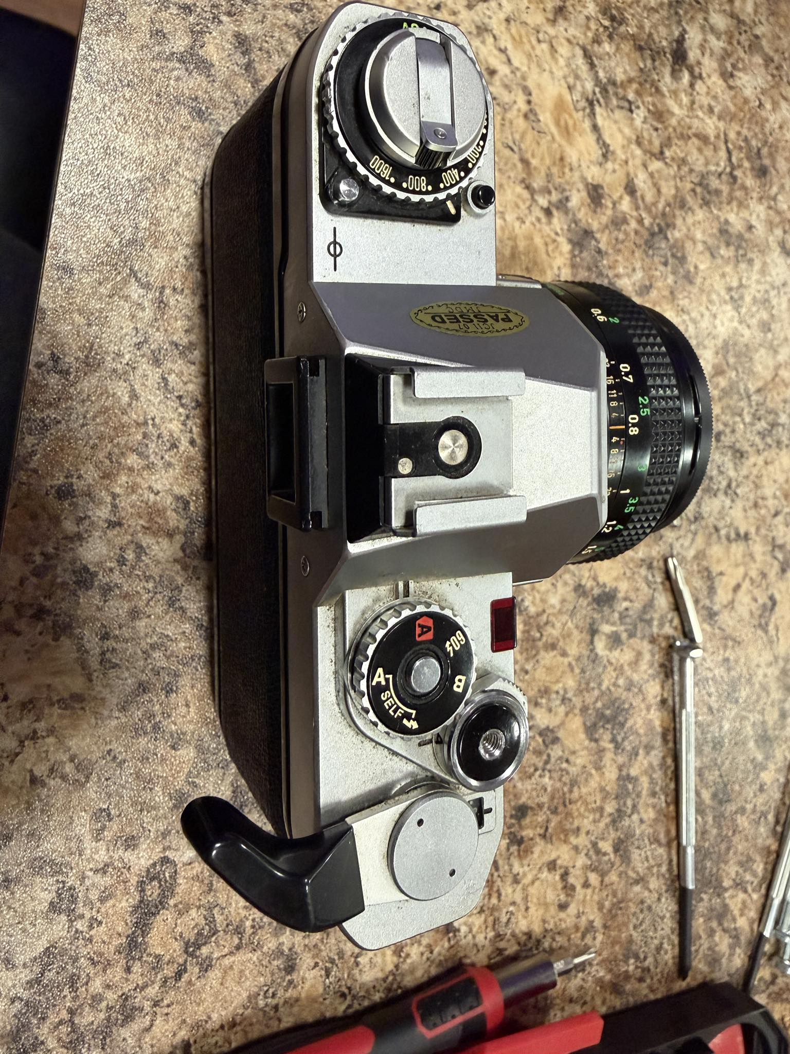 What to do when Canon AV-1 film advance lever is stuck?