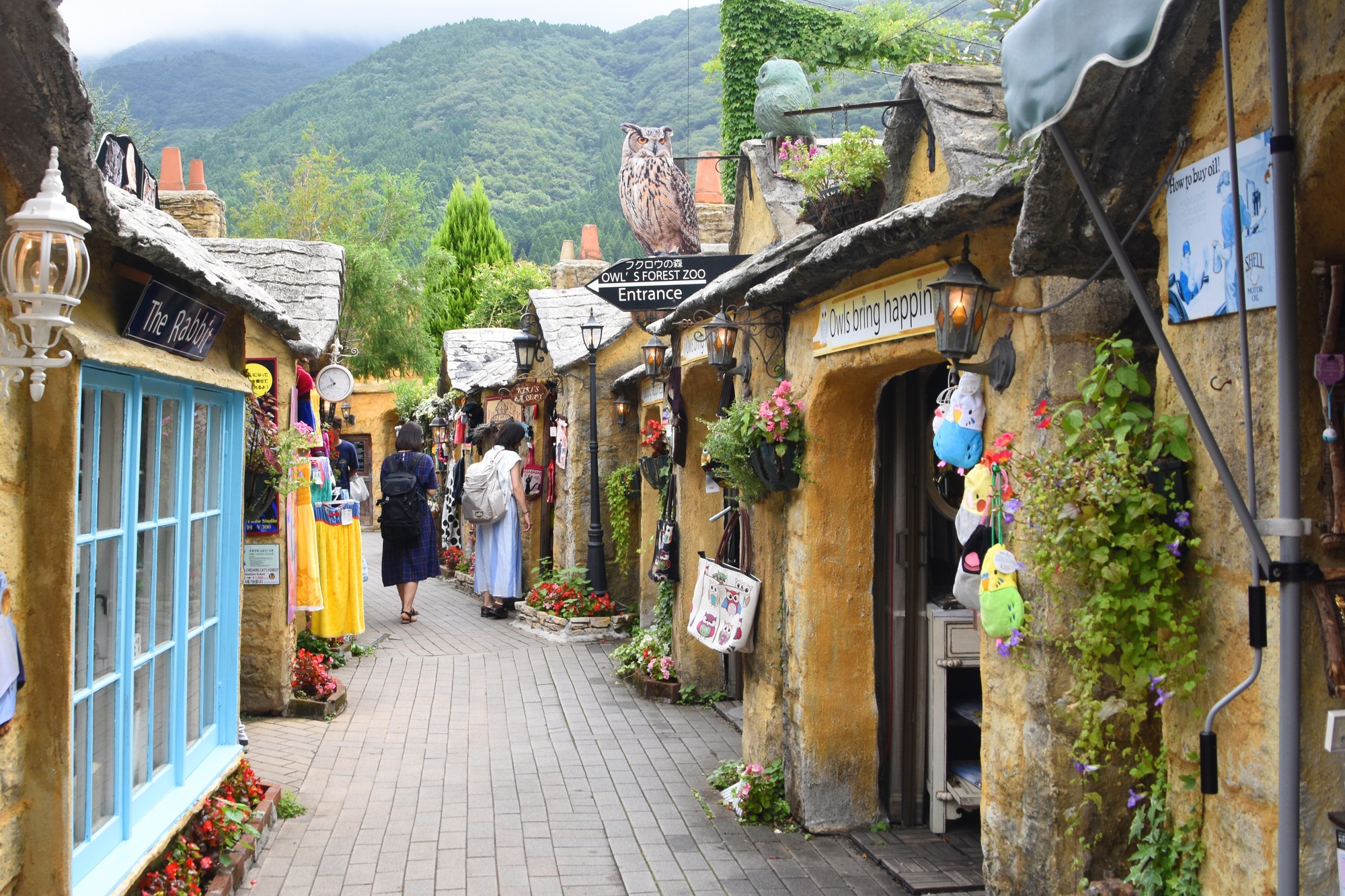 a picturesque anime village nestled amidst rolling hills and