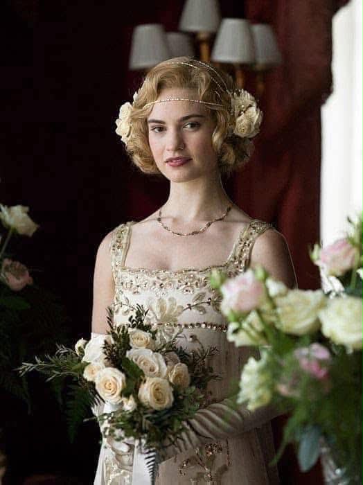 lady rose downton abbey dresses Rose's wedding to banker, Atticus Aldridge in ITV/PBS season 5, episode 8. played by actress Lily James, is wearing a 1920s beaded silk tulle gown featuring dainty gold New Arrivals PF24