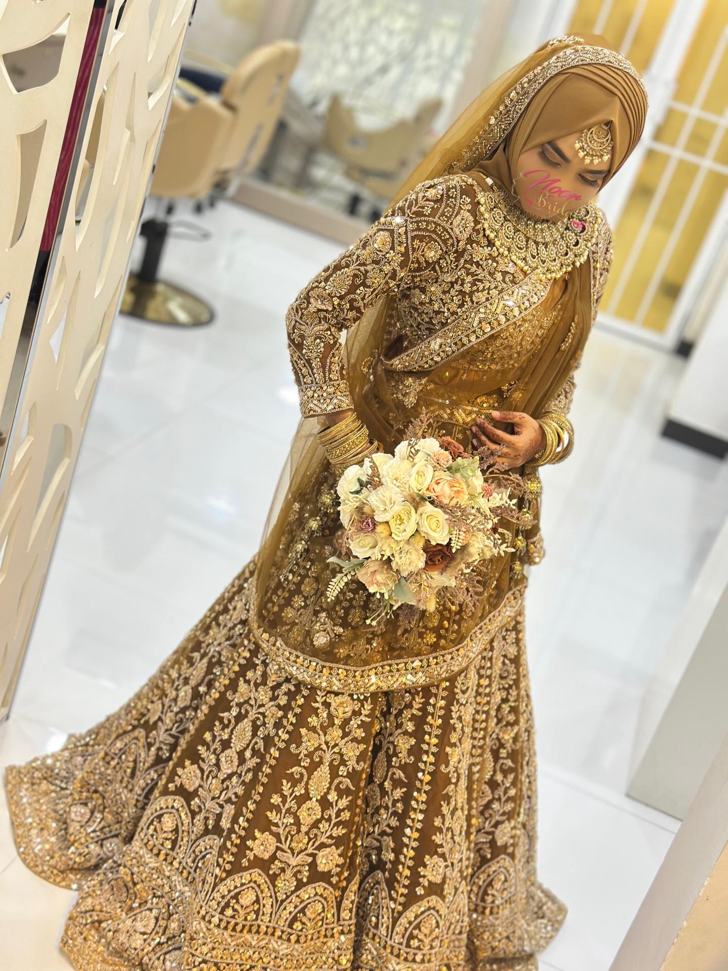 golden dress with hijab Her vision was to look like a simple and elegant Indian hijabi bride 🤍 A soft glam makeover paired a graceful style and a stunning 3-piece Indian lehenga in a gold maroon dress hijab
