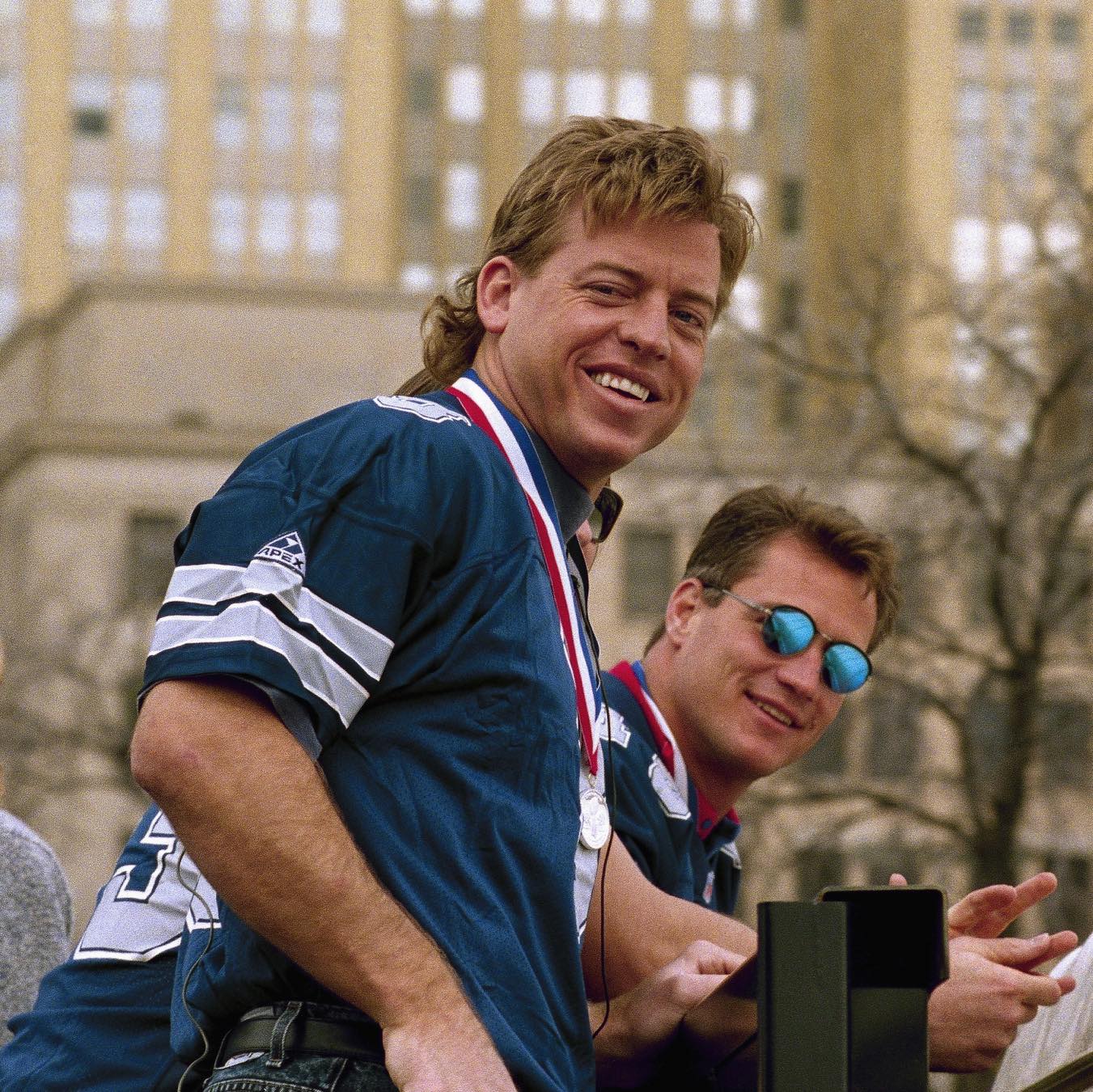 Troy Aikman and Darryl Johnston riding in the Cowboys Super Bowl