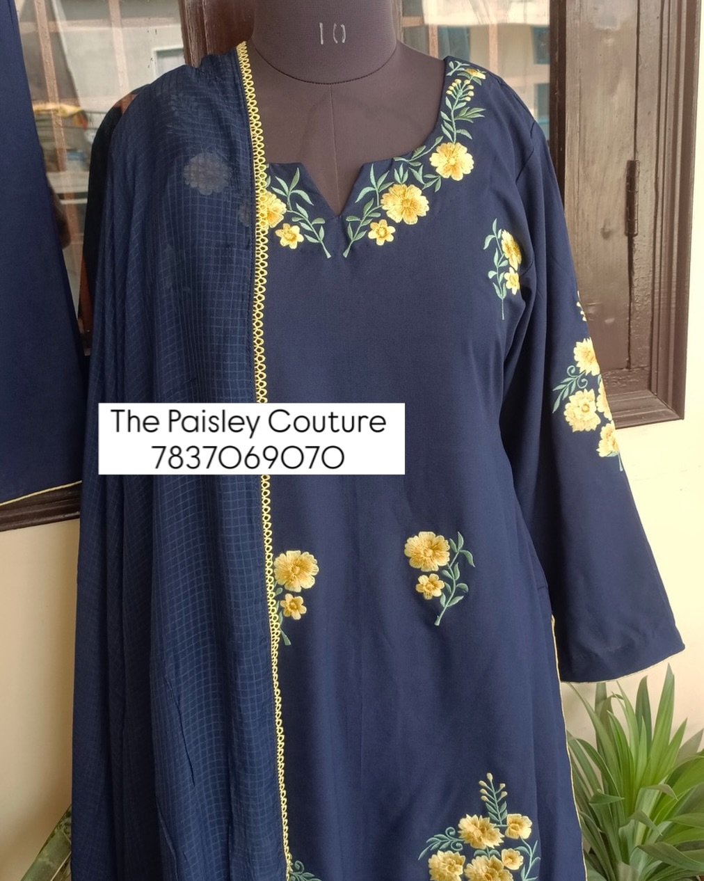 A simple Navy Blue Pakistani style loose fit salwar kameez set, beautifully adorned with multiple shades of yellow machine embroidery, crafted exclusively by our hardworking karigars ✨ P.S. This is not cheap