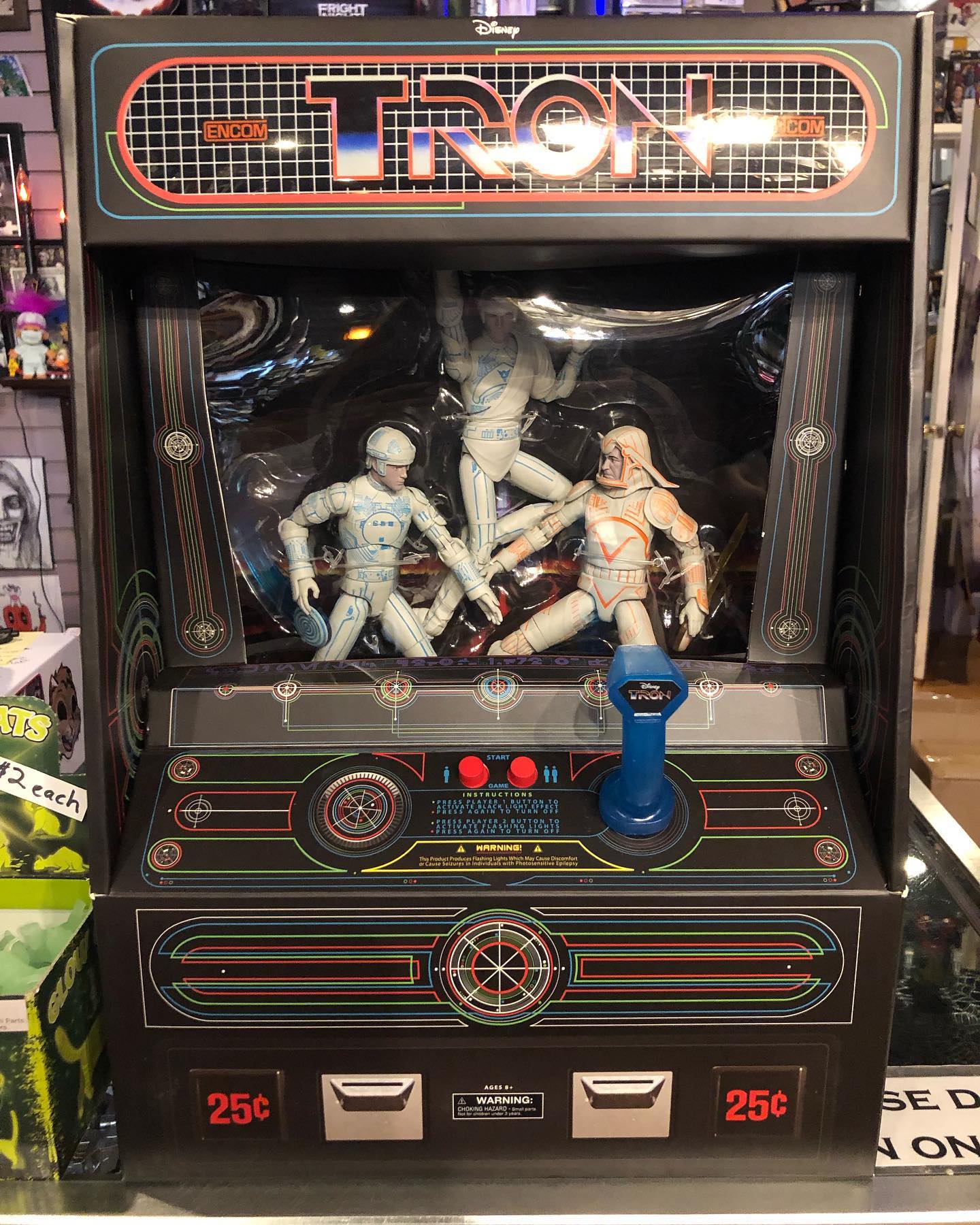 Classic Tron deluxe action figure set with arcade style packaging