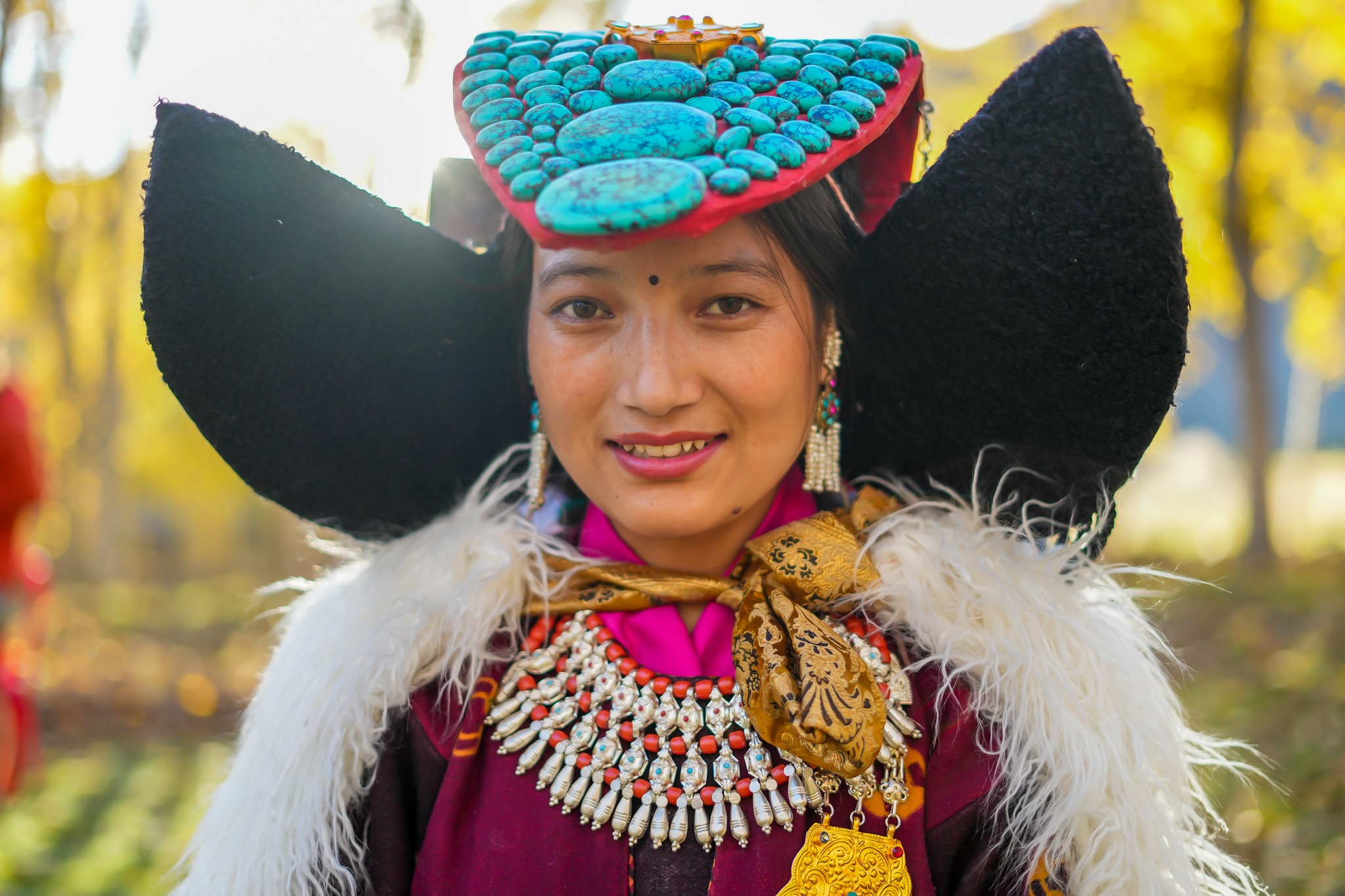Ladakhi Dancer, Northern India: • The turquoise headdress is 