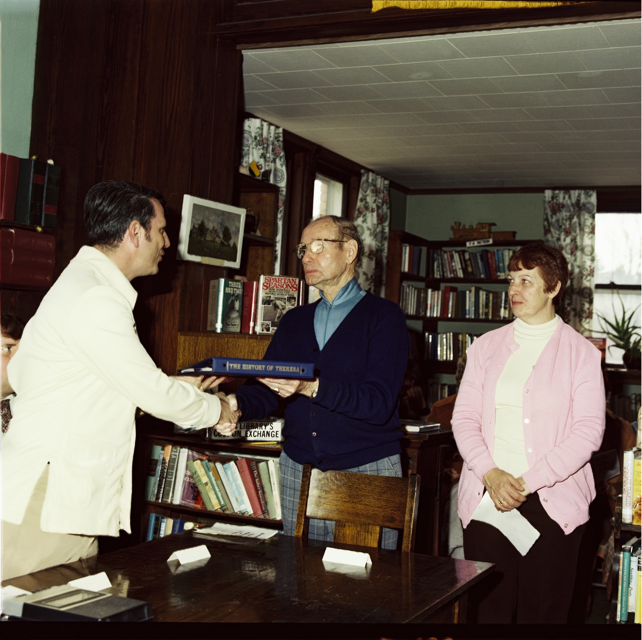 Town - Orin S. Wilcox receives a copy of 'The History of Theresa' from ...