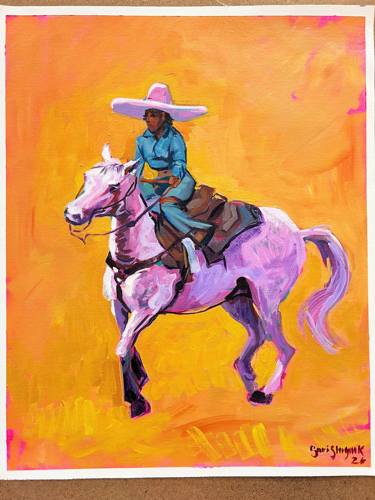 8. a rider dresses in layers to Caught this moment at practice near the Will Rogers arena. from an escaramuza charra team, poised on her white horse traditional dress and sombrero. Escaramuza charra is the all-female region-Colombia