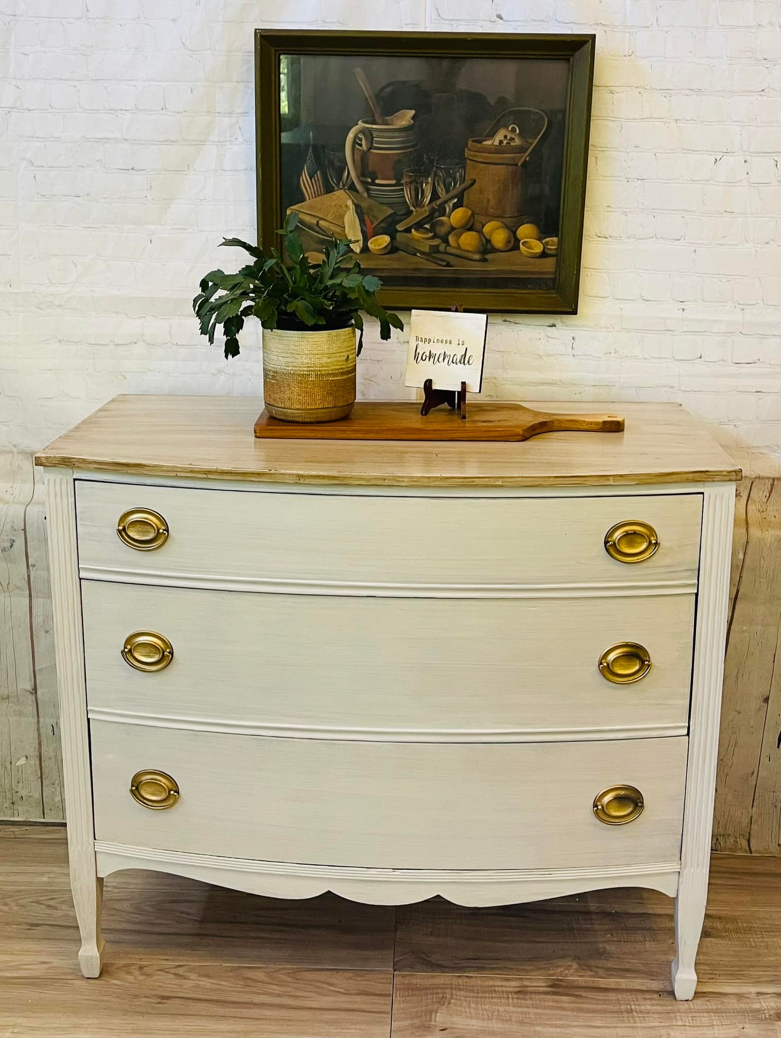 distressed white dresser Swedish complemented by black metal bar pulls on all drawers and the central cabinet American Woodcrafters Stonebrook Dresser (Antique