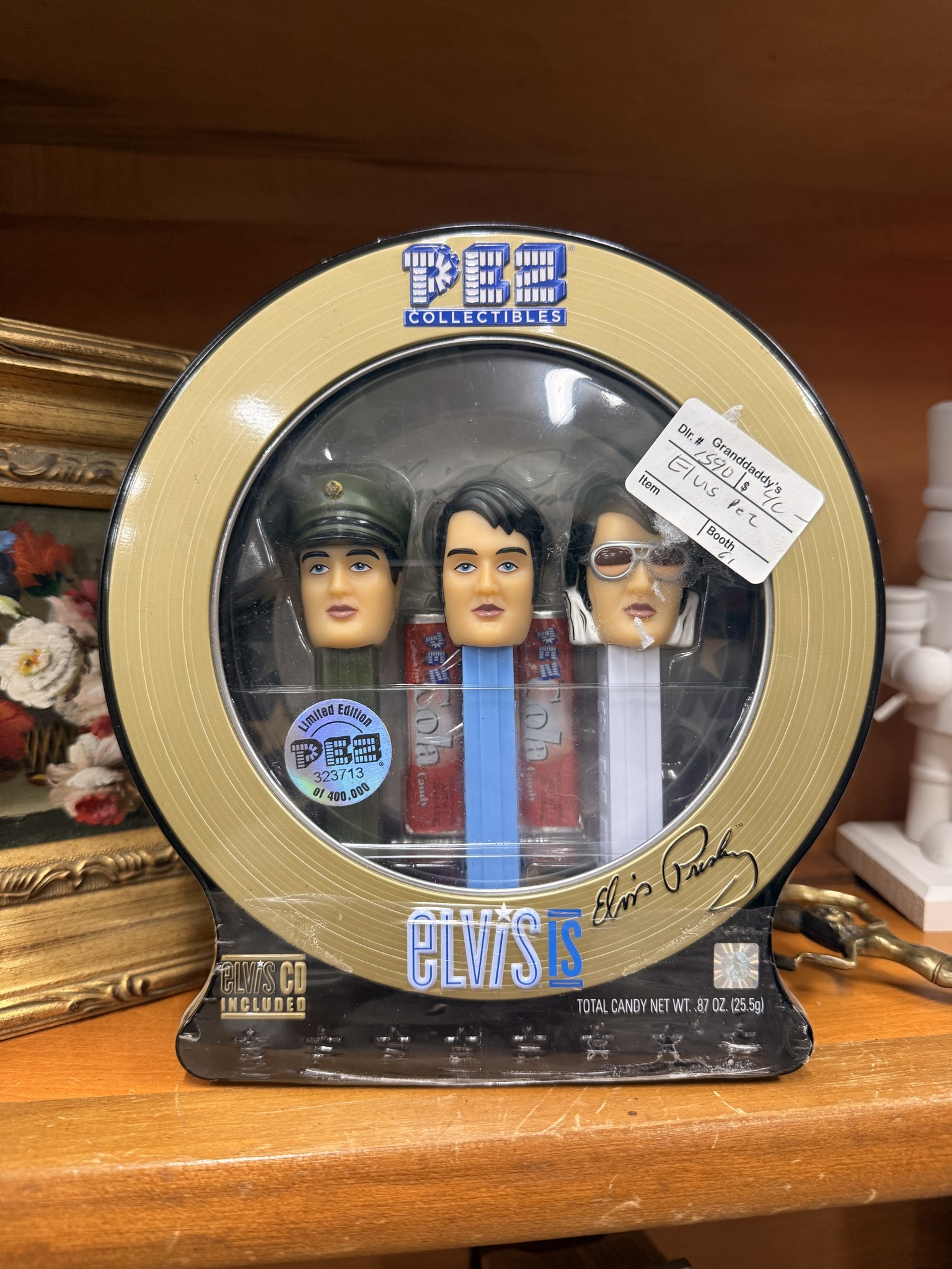 Collectible PEZ Elvis Presley gift set in a round silver and black
