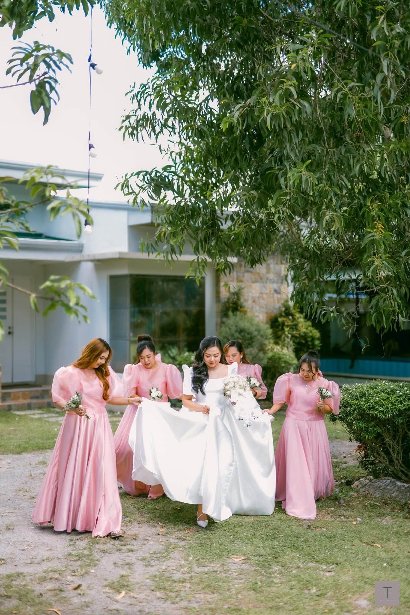 Soft, Sculpted, and Timeless. Our classic Filipiniana bridesmaid gowns bring together iconic butterfly sleeves with lightweight, cascading skirts together with the groomsmen wearing classic embroidered barong. Designed to complement the bride's Mikado