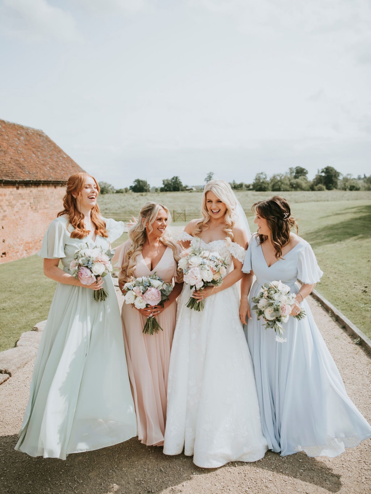 Magic Moments ✨ Breathtaking bride @jessicastaceyx surrounded by absolute joy and her bridesmaids wearing a mix of our Phoebe dress in Dusty Eucalyptus, Blush Pink & Dusty Blue. Venue - @grangefieldsvenue Photographer