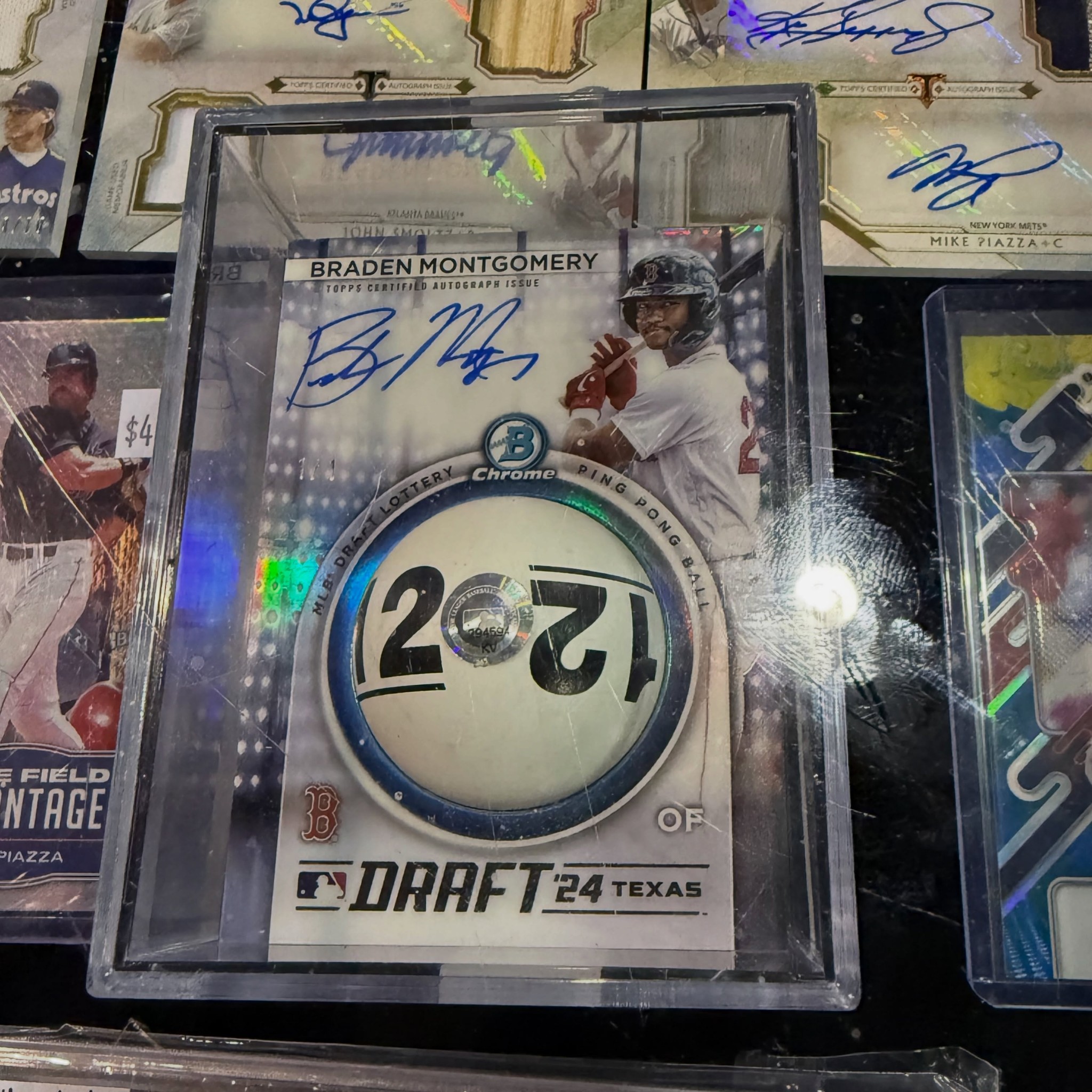 This 1-of-1 autograph card has an actual ping pong ball from the