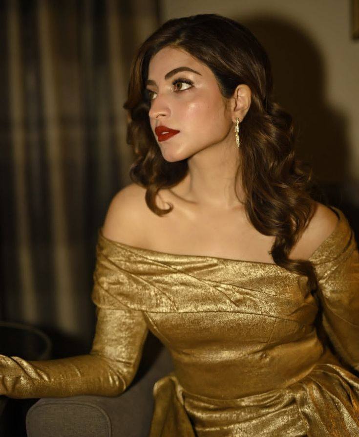 gold dress red lips Golden goddess! Kinza Hashmi bringing pure heat in a metallic off-the-shoulder outfit and classic lip. 💛🔥 #KinzaHashmi #GoldenGlam #BoldBeauty #PakistaniCelebs #StatementLook Tiered Dresses