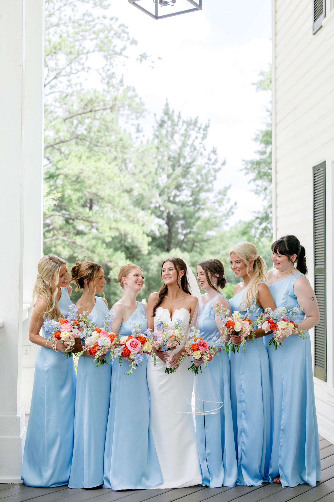 The perfect summer palette! 🩵 We love seeing this bridal party in Sky Blue for a bright outdoor ceremony ✨ Photographer: @katieandalecphoto . . . . . #weddingday #bridesmaids #bluebridesmaids #bridesmaiddresses #weddinginspo