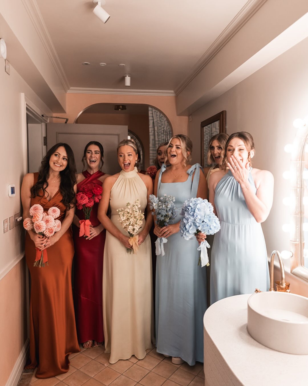 Single-variety bridesmaids bouquets have become one of our favourite design choices especially when you've got a big gang by your side. Each maid carries one bloom en masse, creating impact, cohesion and