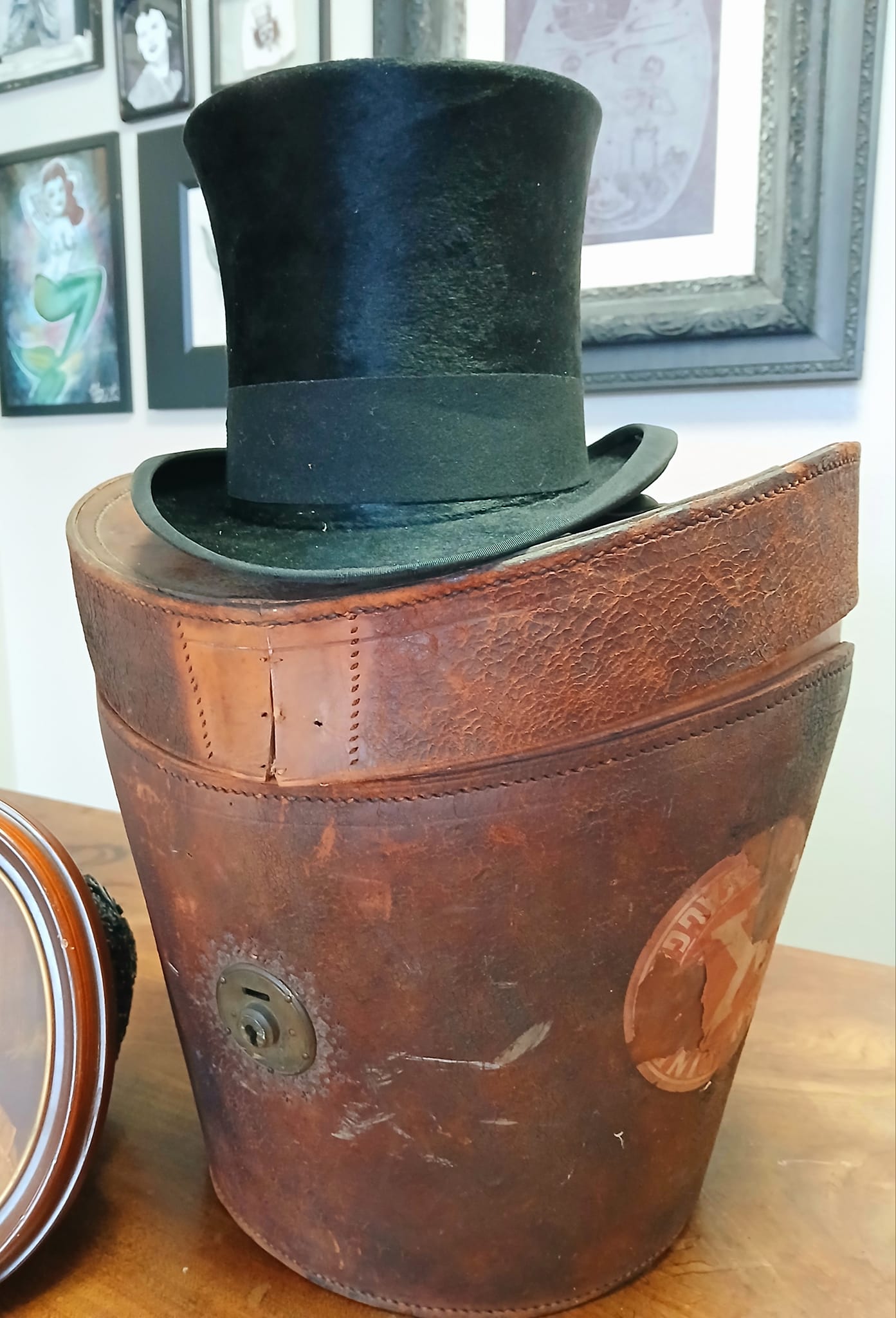 Vintage silk top hat with leather box and RMS Umbria baggage tags