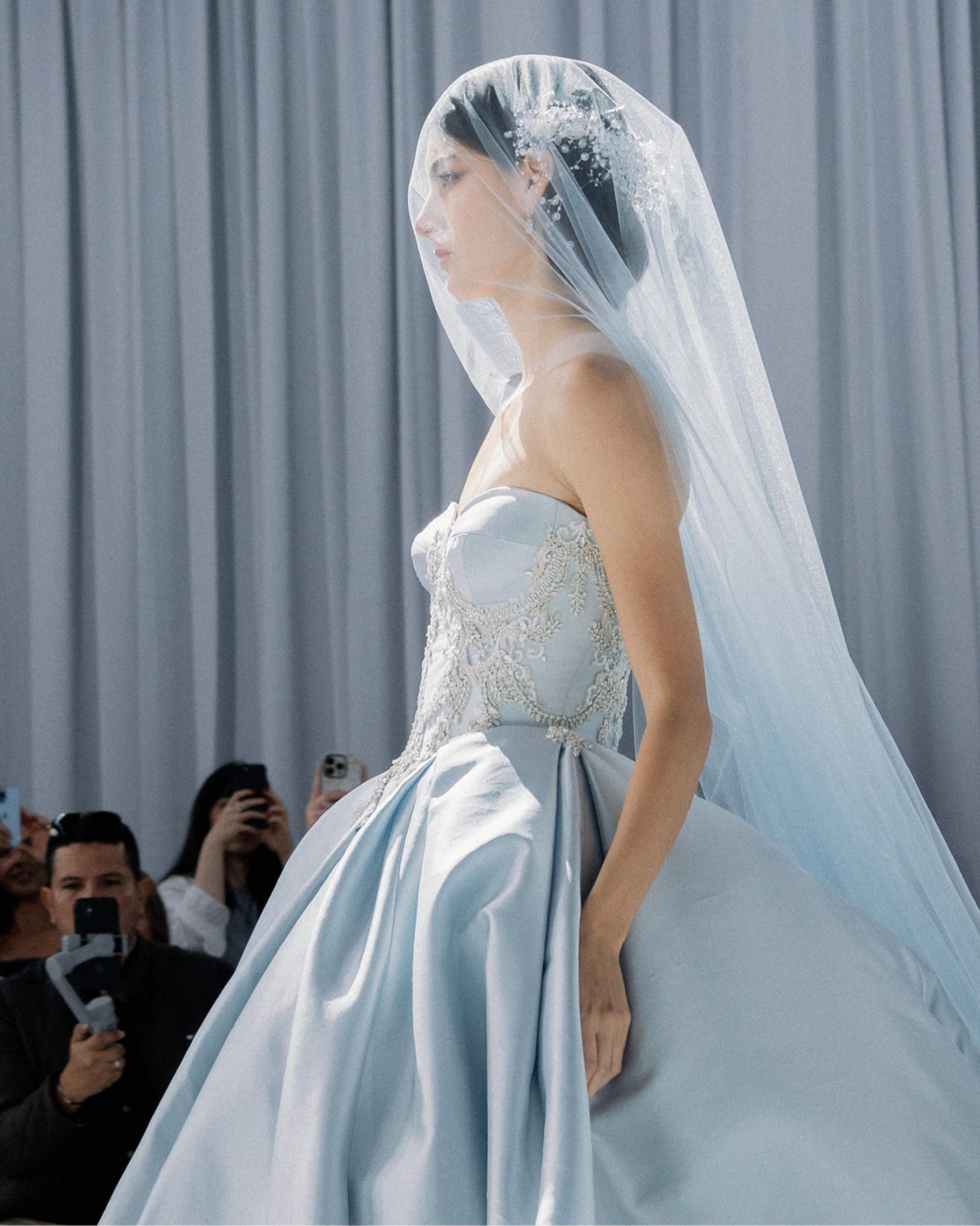 Not every bridal statement is made in ivory. Clancy brings a fresh perspective to the SP27 Maison Perez designed by Lazaro collection in an unforgettable shade of ice blue