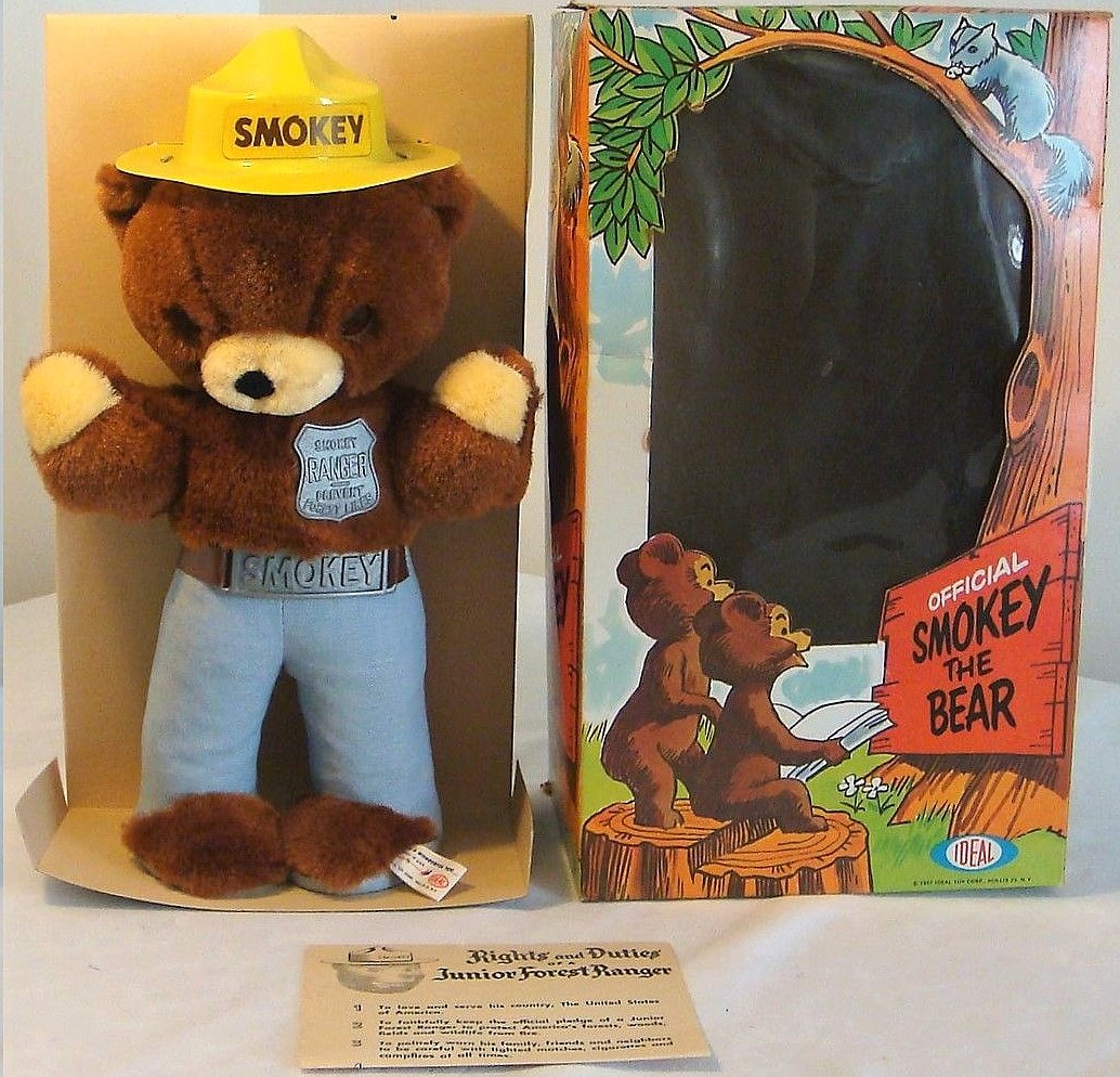 I believe 1970s vinyl Smokey Bear figure in the original plastic