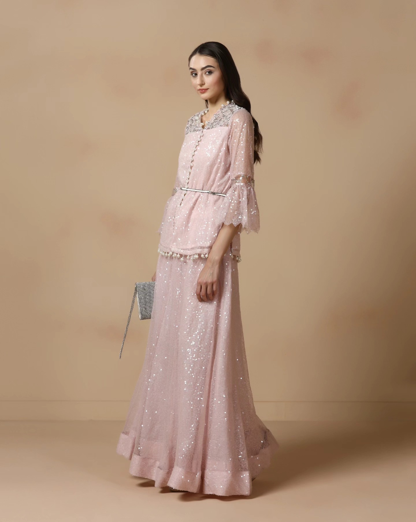 Lavender, but make it unforgettable. ✨ A fluid all-over sequined skirt gown layered with a timeless front-button jacket, delicately detailed with cut dana superimposed embroidery on the yoke — this ensemble is